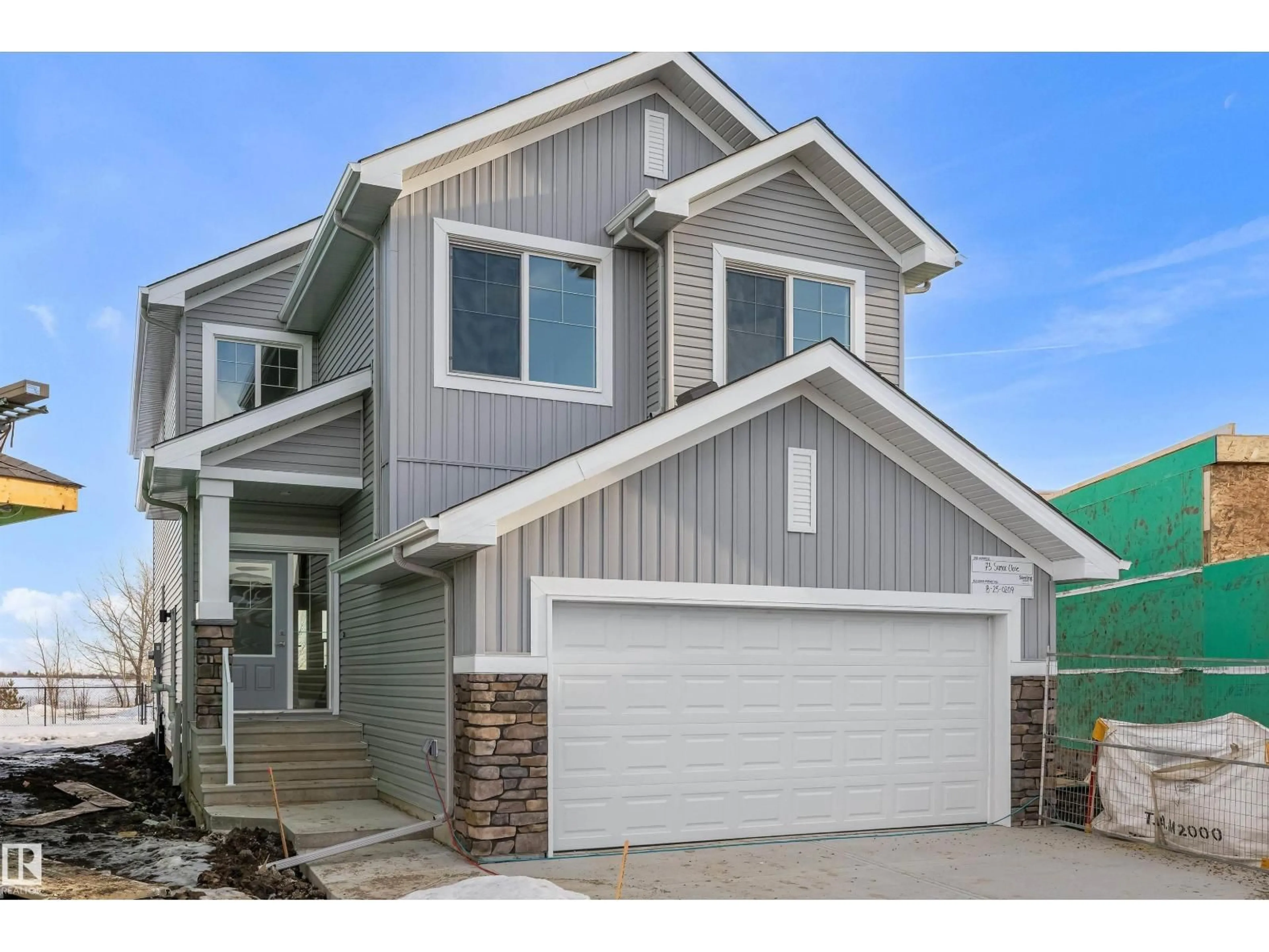 Home with vinyl exterior material, street for 73 SUMAC CL, Fort Saskatchewan Alberta T8L0Z9