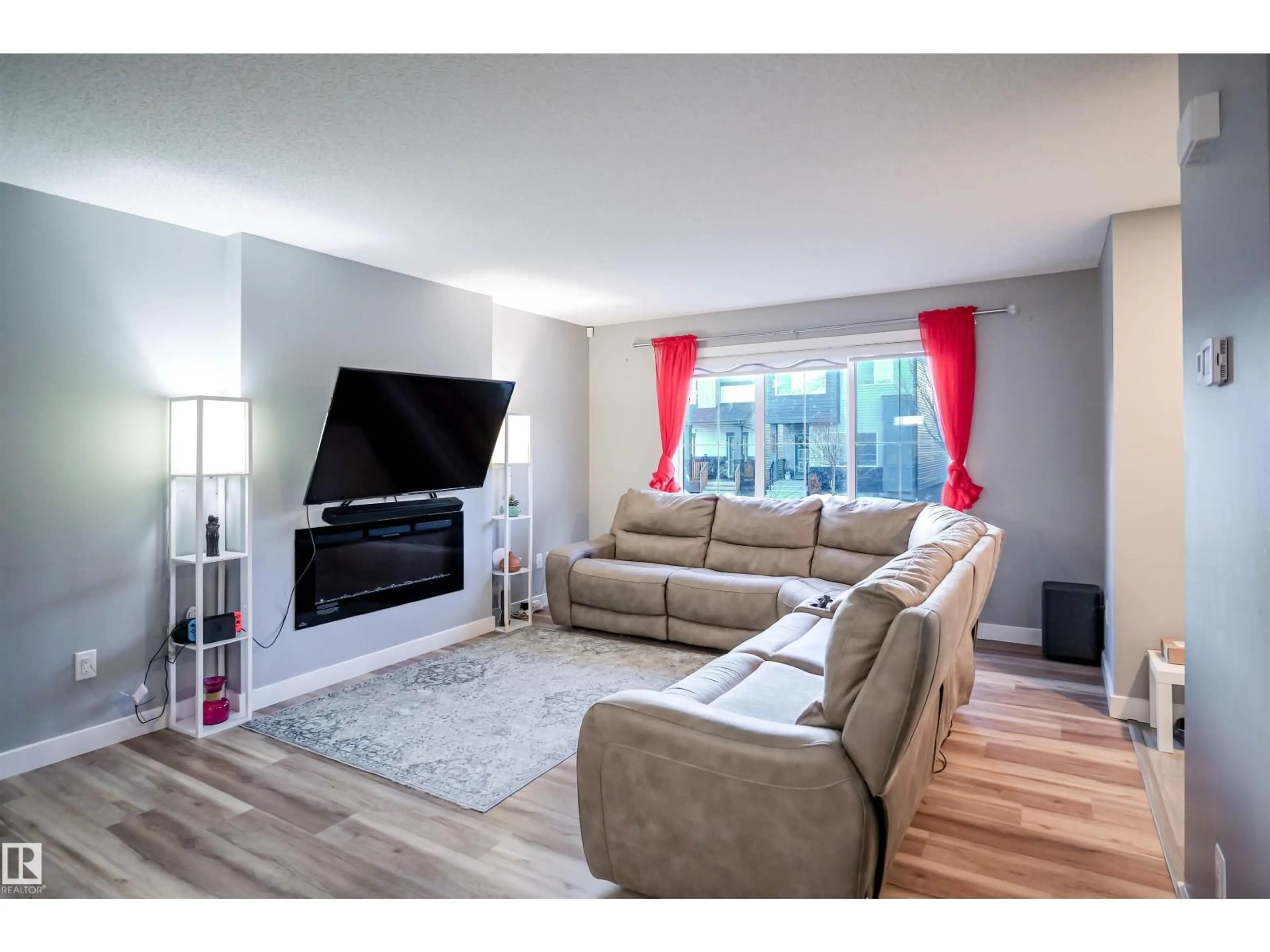 Living room with furniture, wood/laminate floor for 4027 3 STREET, Edmonton Alberta T6T2E8