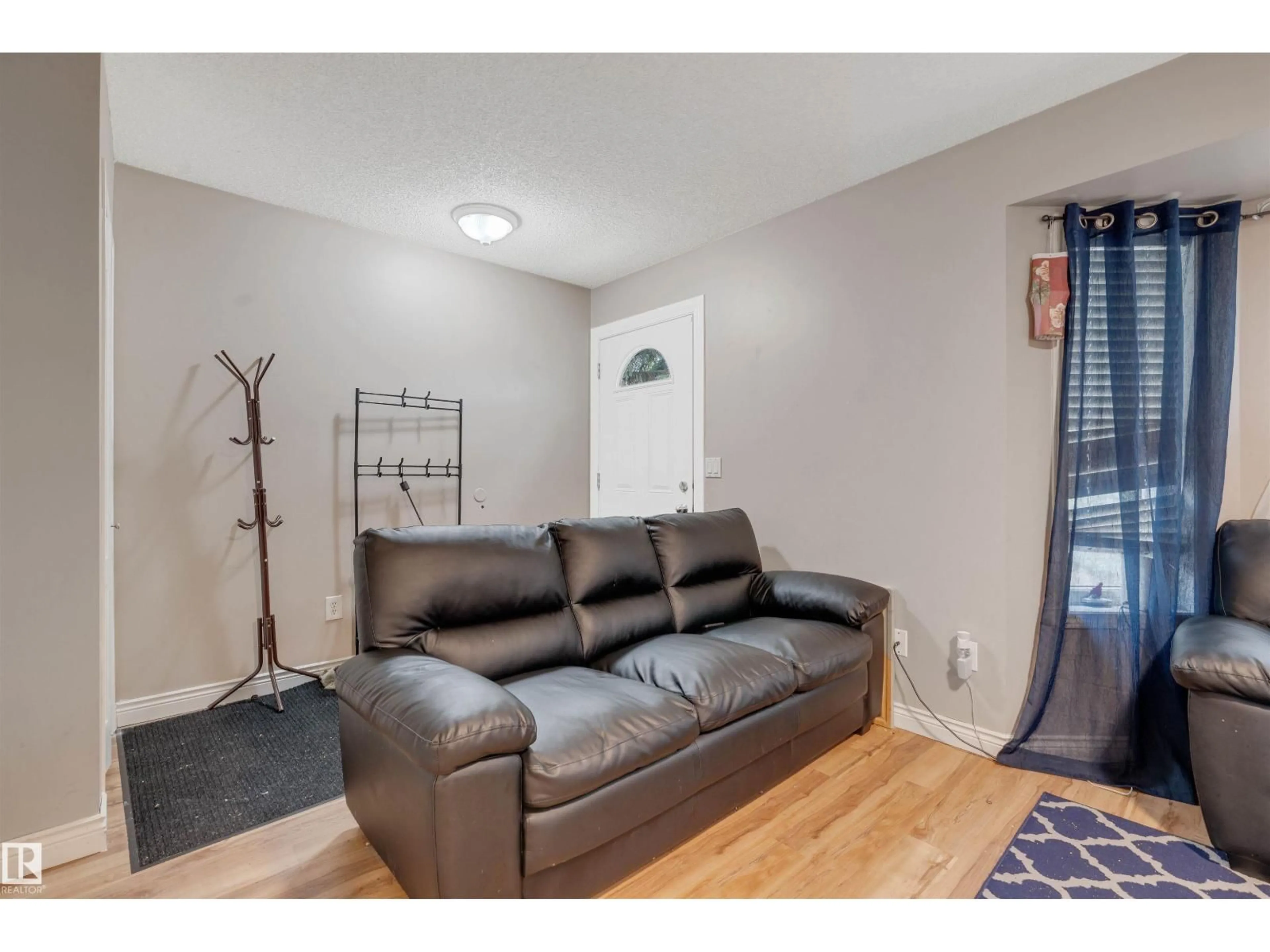Living room with furniture, unknown for NW - 12957 - 12959 117 ST, Edmonton Alberta T5E5J8