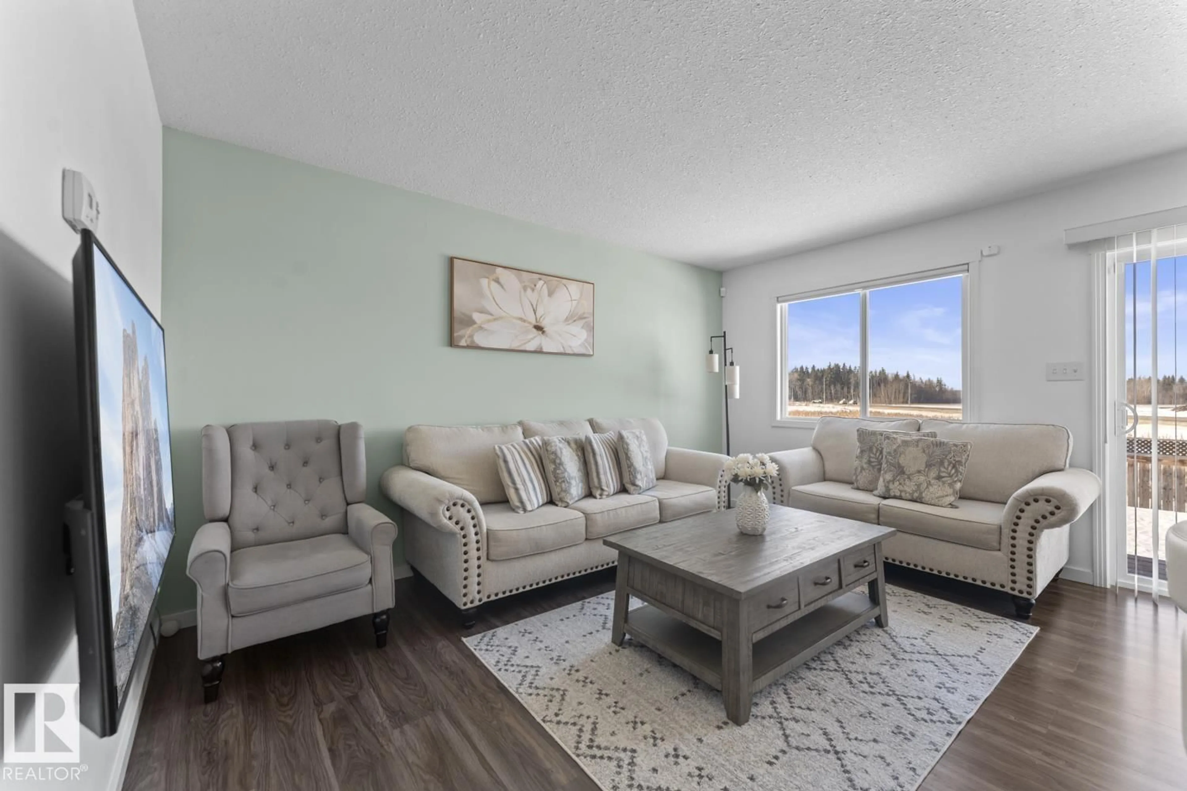Living room with furniture, wood/laminate floor for 707B ROCKY WY, Cold Lake Alberta T9M0H3