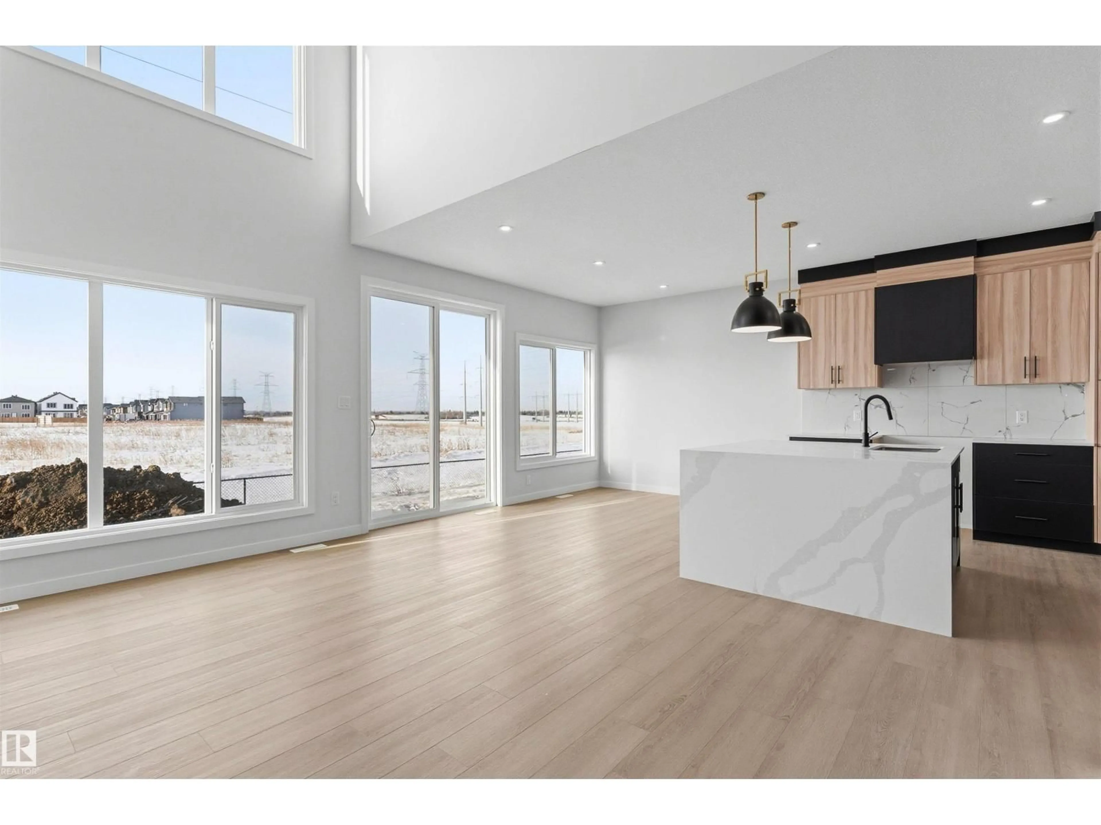 Open concept kitchen, wood/laminate floor for 120 25 ST, Edmonton Alberta T6X3K3