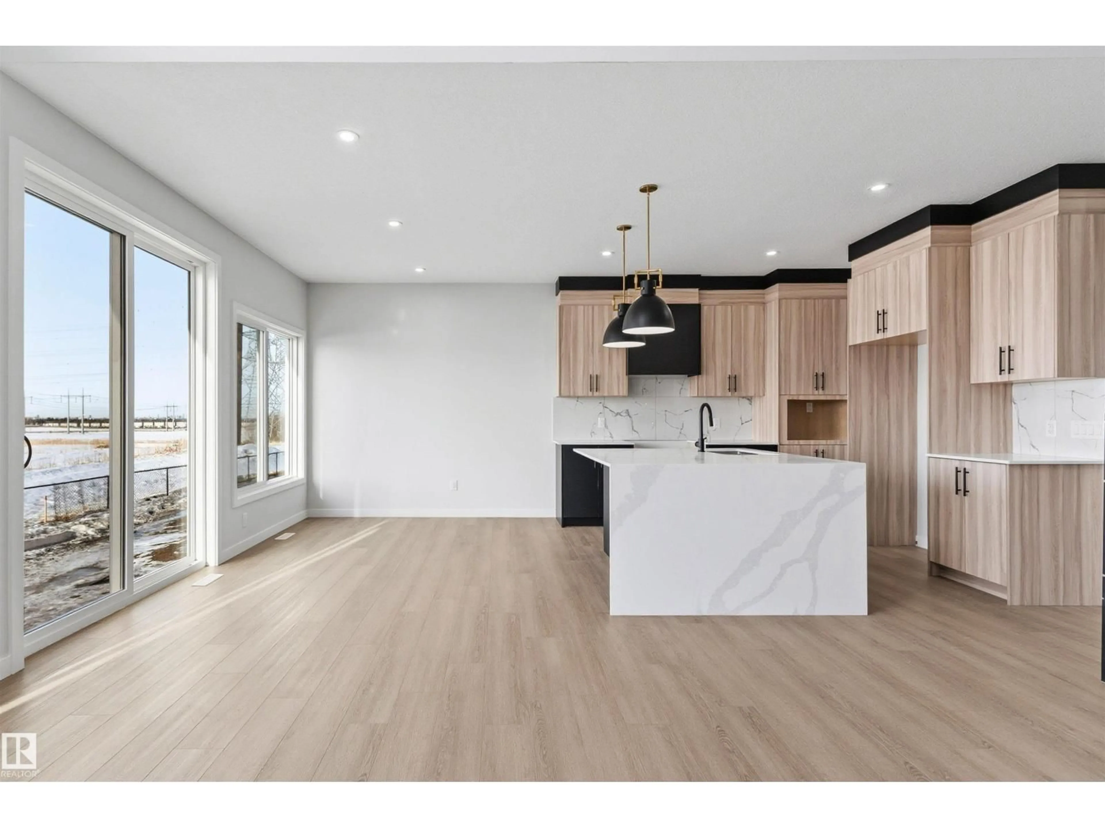 Open concept kitchen, wood/laminate floor for 120 25 ST, Edmonton Alberta T6X3K3
