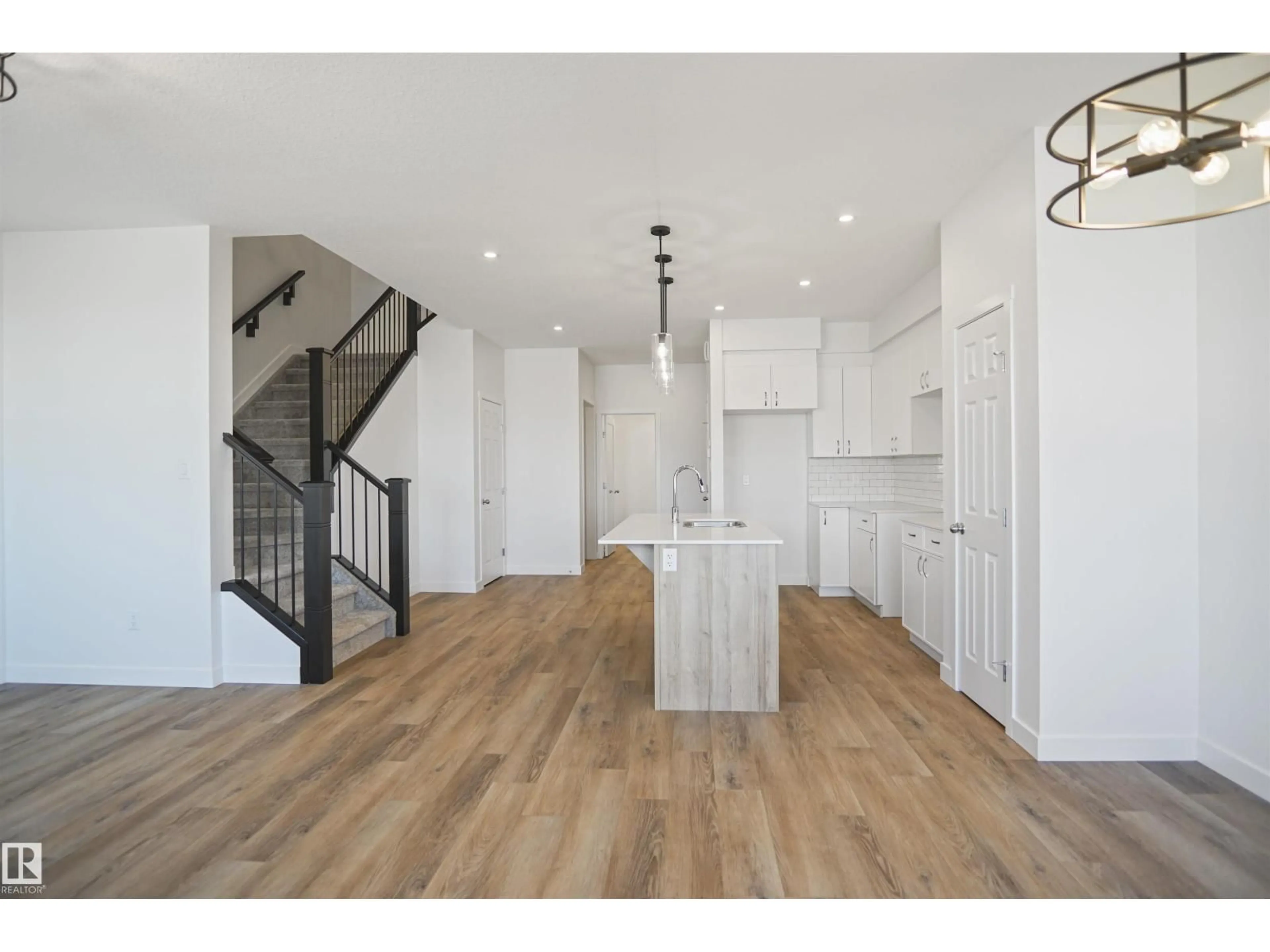 Open concept kitchen, wood/laminate floor for 18955 28 AV, Edmonton Alberta T6M1P7