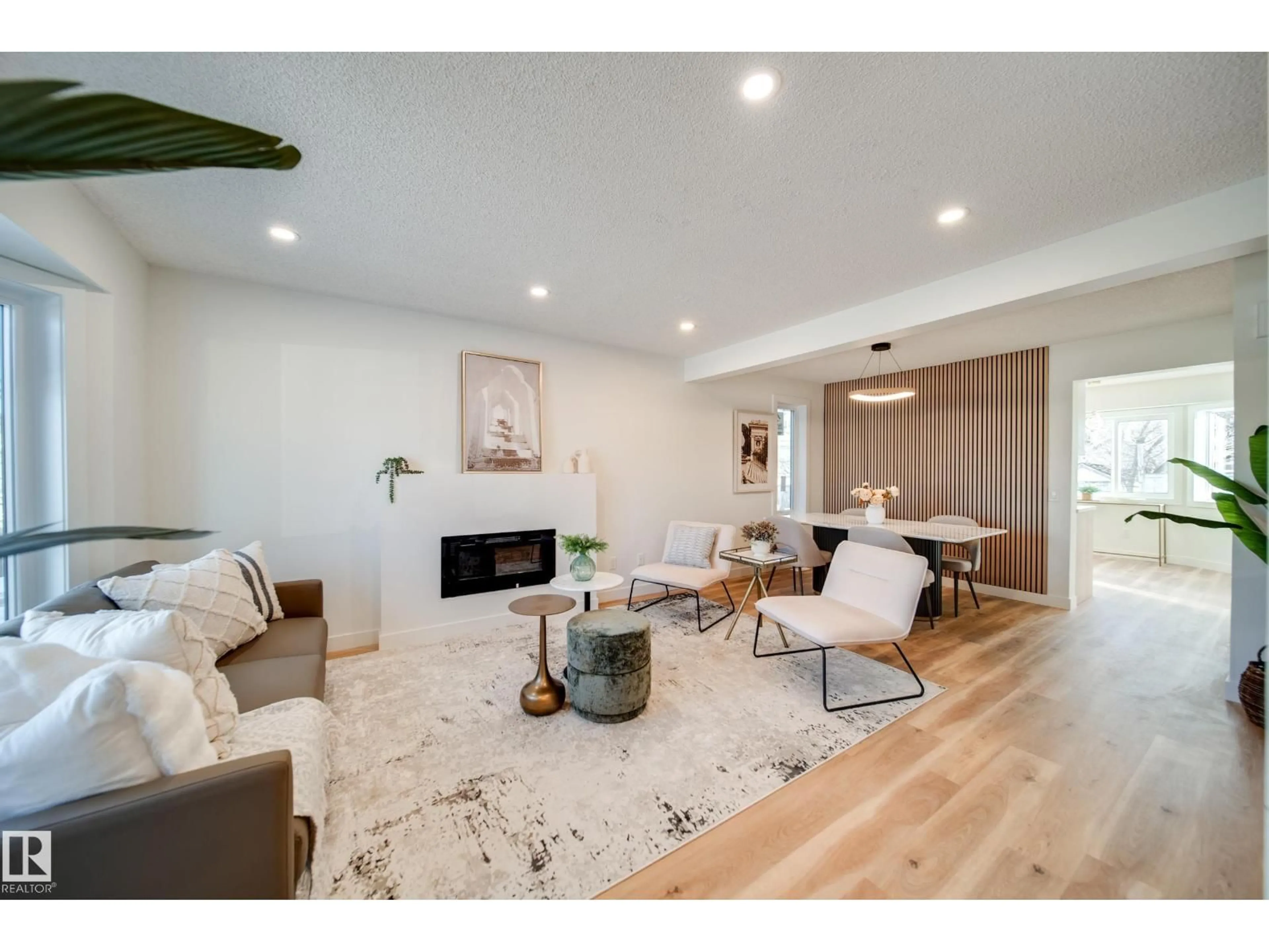 Living room with furniture, wood/laminate floor for 4019 37 ST, Edmonton Alberta T6L6H2