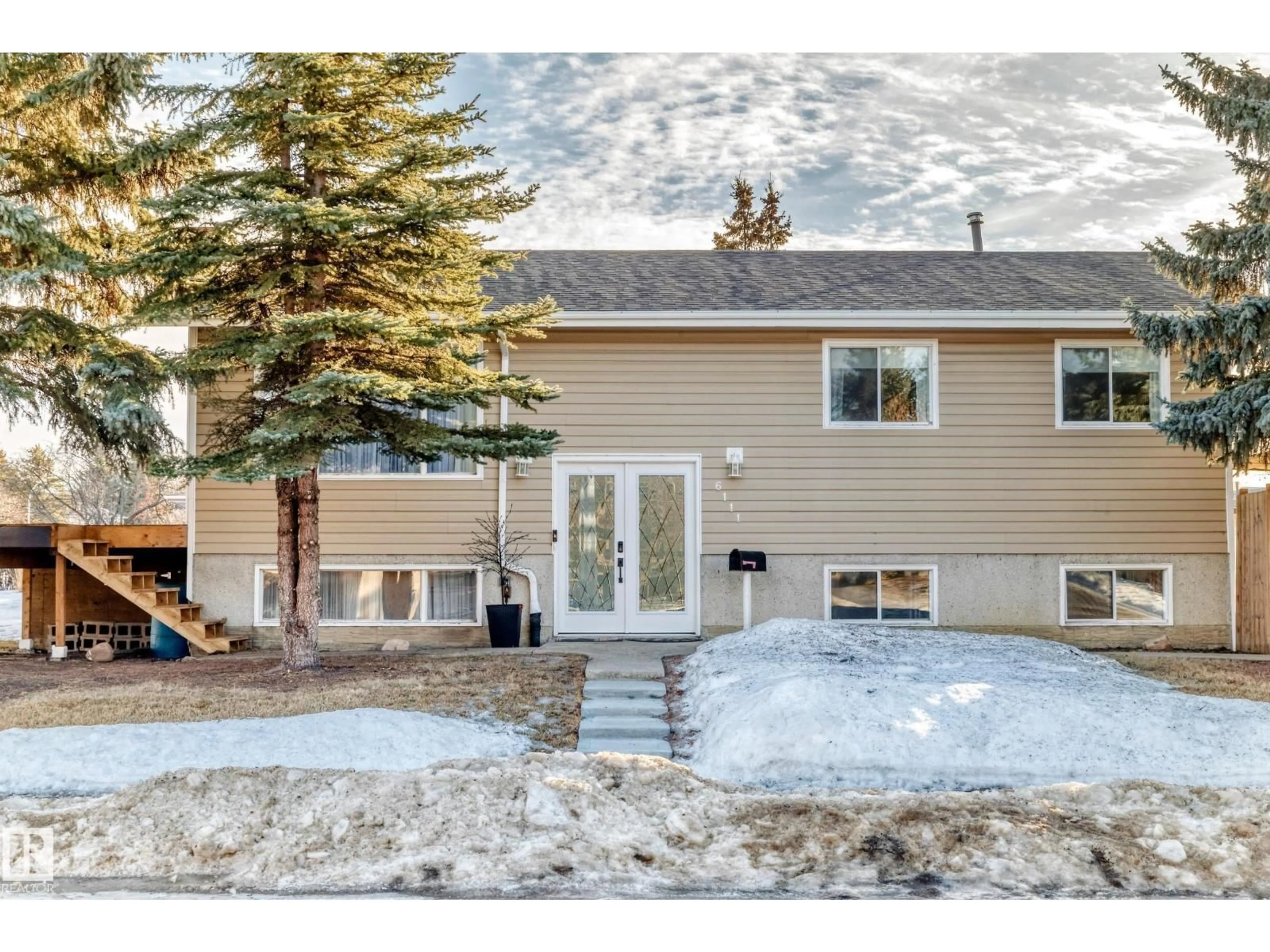 Home with vinyl exterior material, street for 6111 18 AV NW, Edmonton Alberta T6L1M9