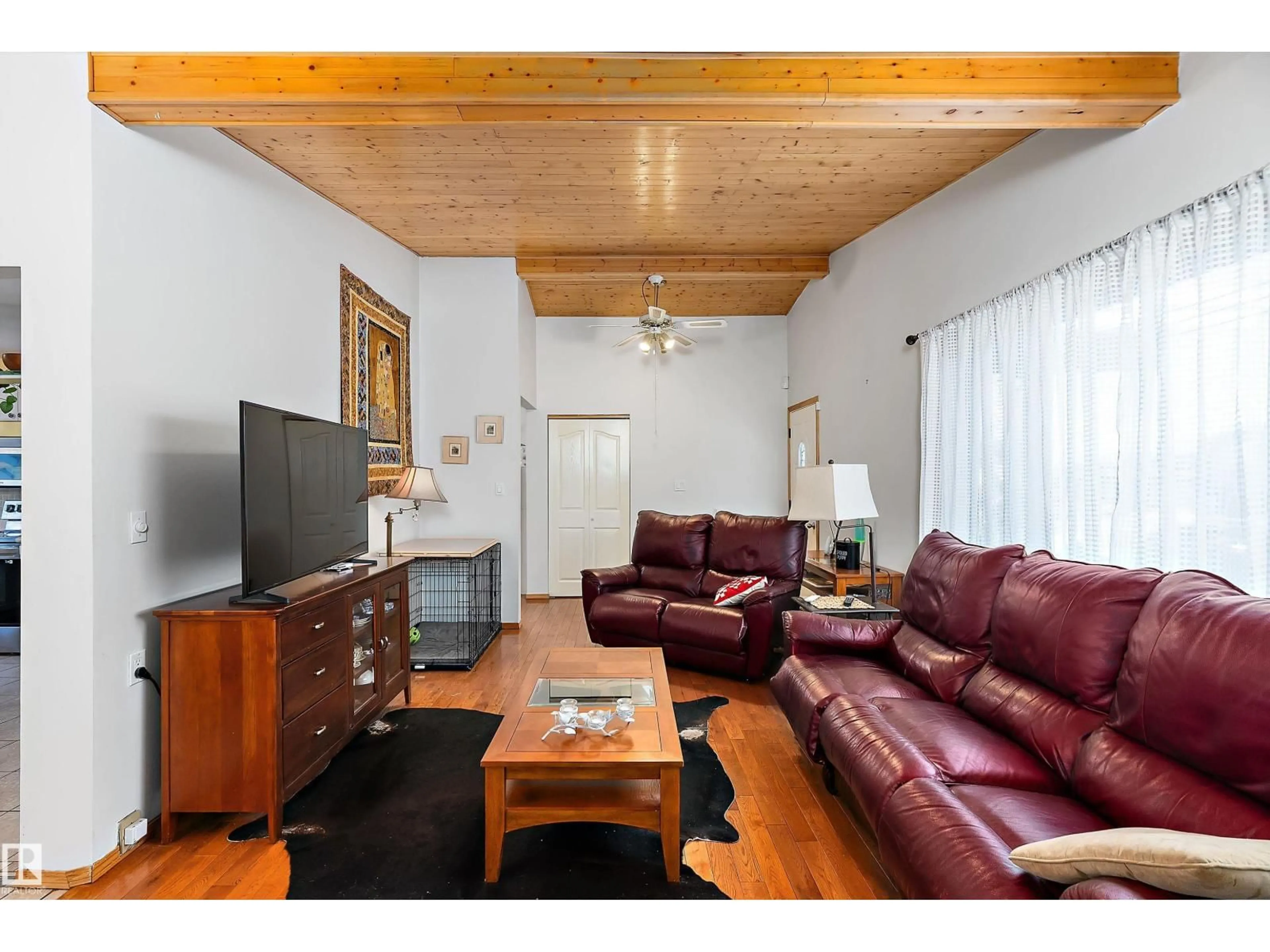 Living room with furniture, wood/laminate floor for 7 MOHAWK CR, Leduc Alberta T9E4G4