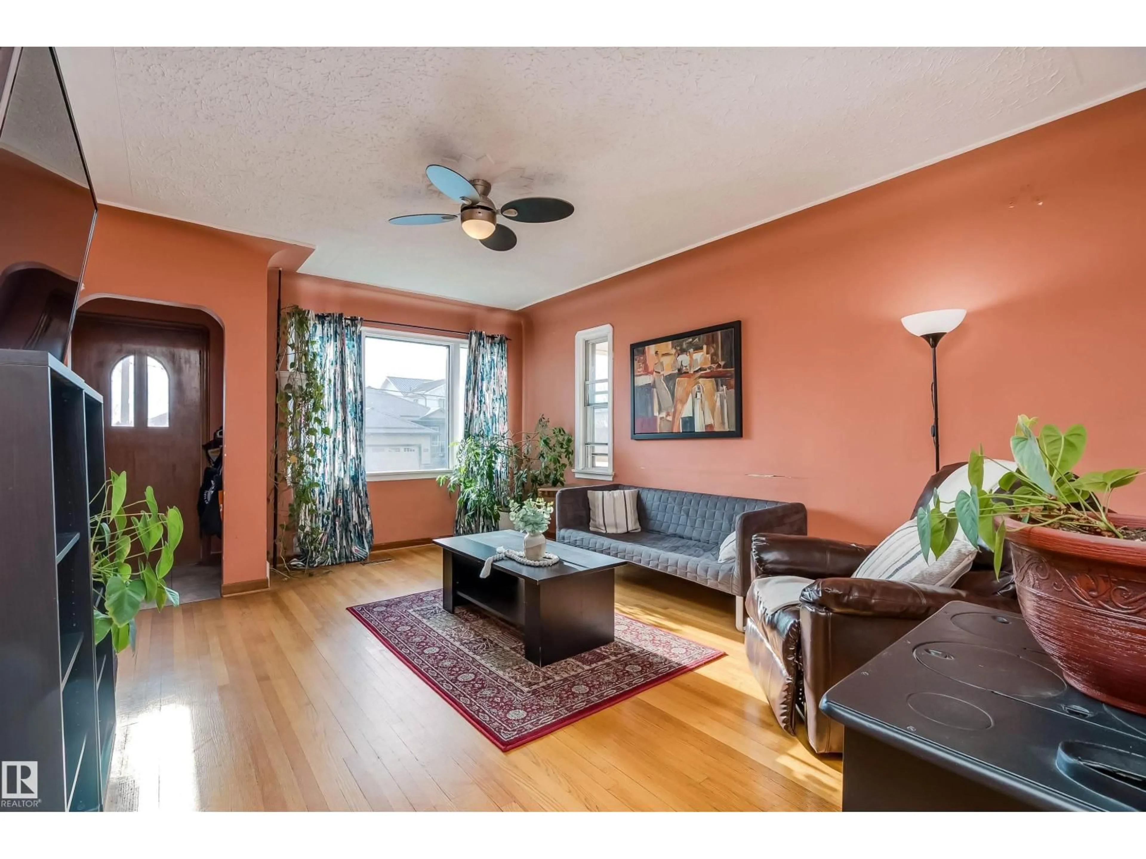 Living room with furniture, wood/laminate floor for 4426 53 AV, Leduc Alberta T9E5W4