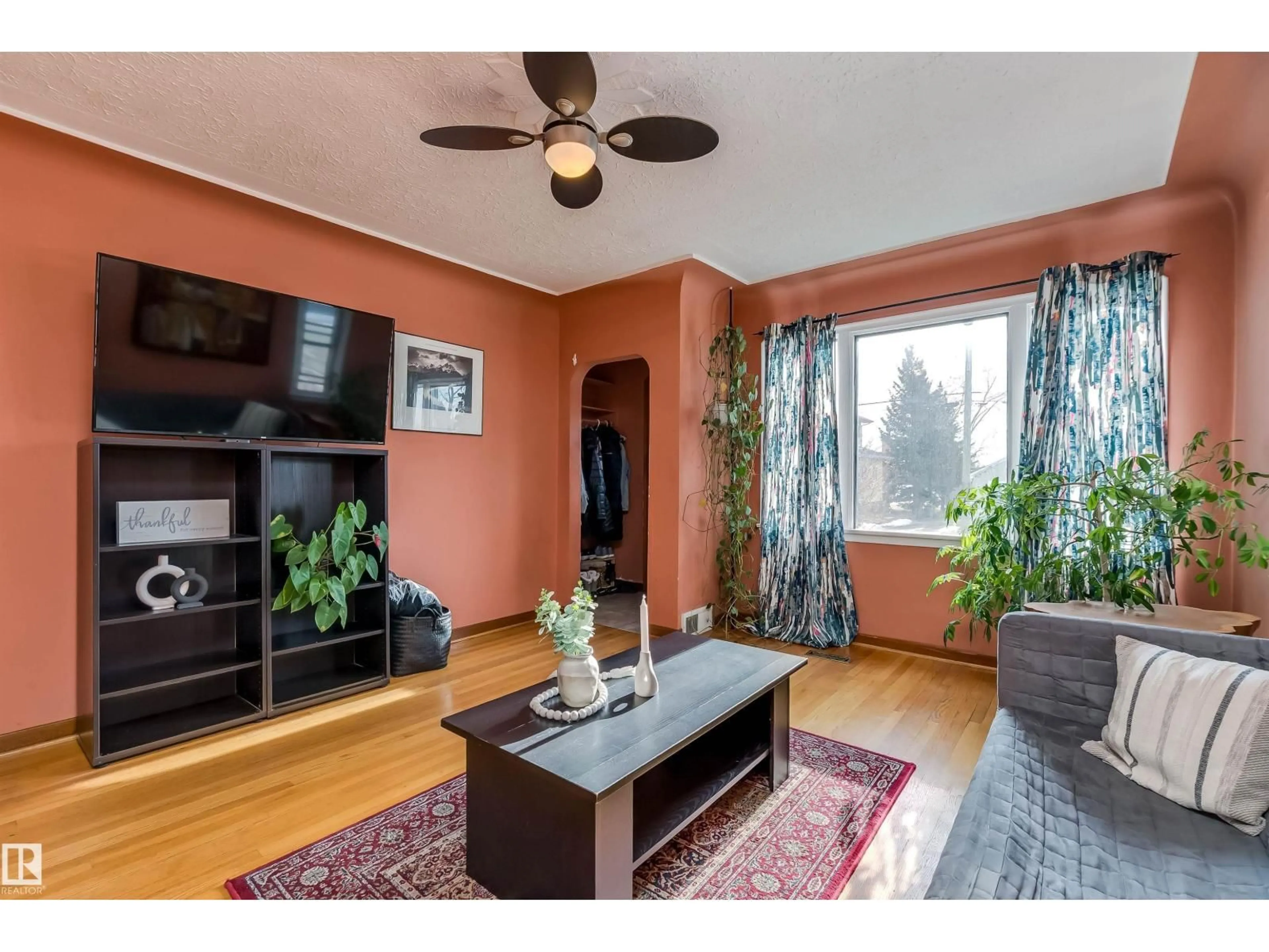 Living room with furniture, wood/laminate floor for 4426 53 AV, Leduc Alberta T9E5W4
