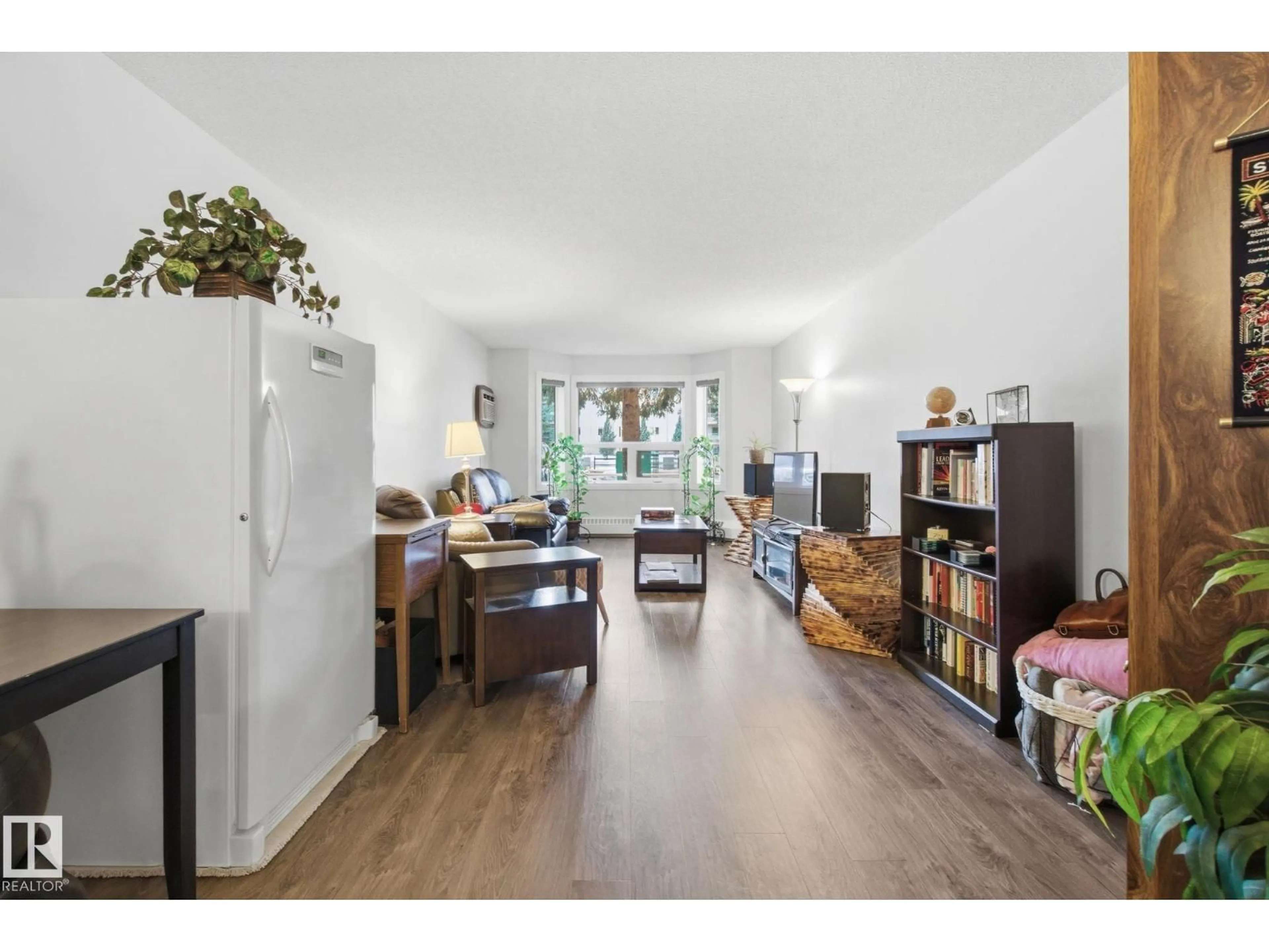 Living room with furniture, wood/laminate floor for #113 - 10935 21 AV, Edmonton Alberta T6J6R3