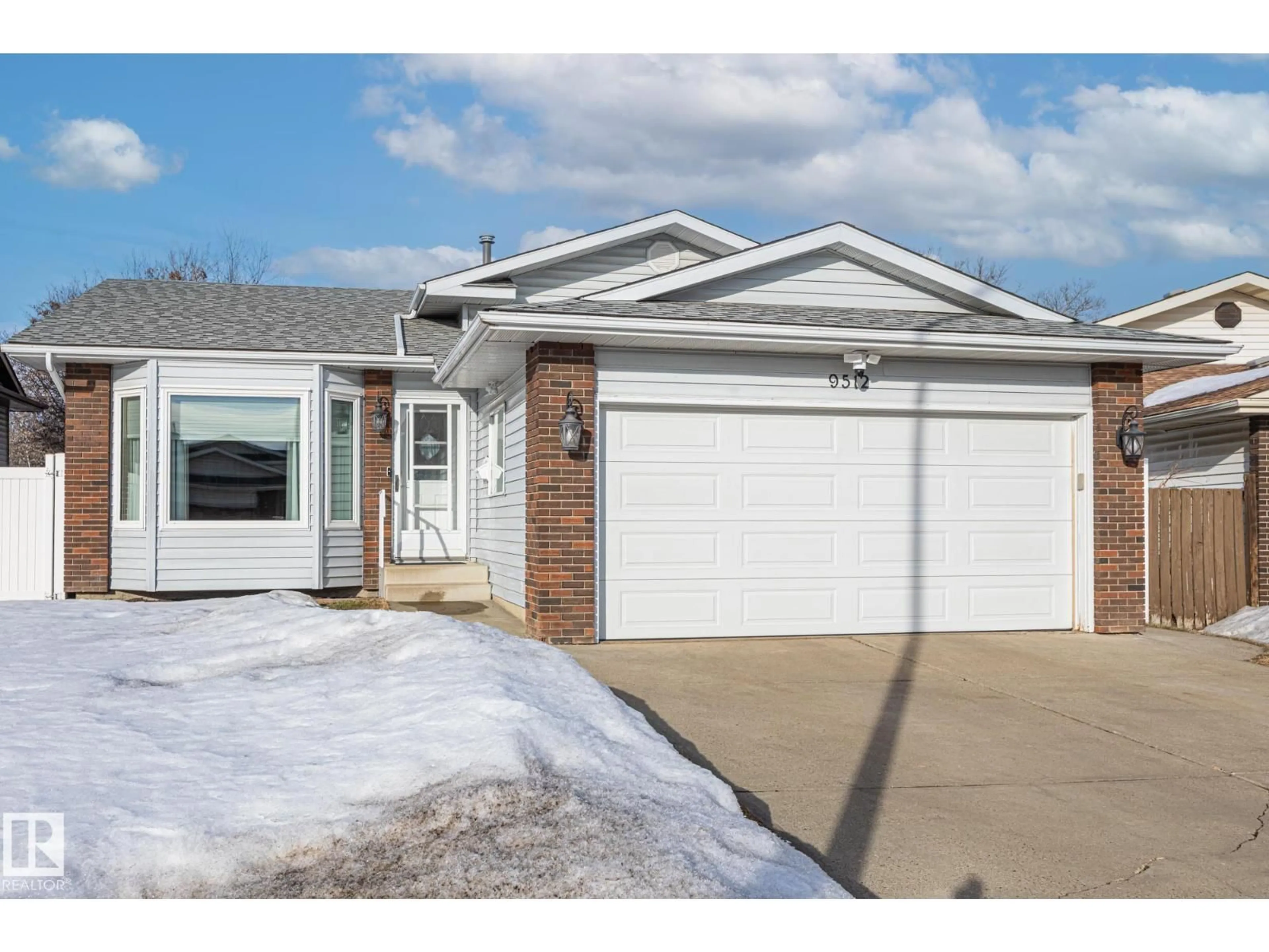 Home with vinyl exterior material, street for 9512 180A AV, Edmonton Alberta T5Z2G1