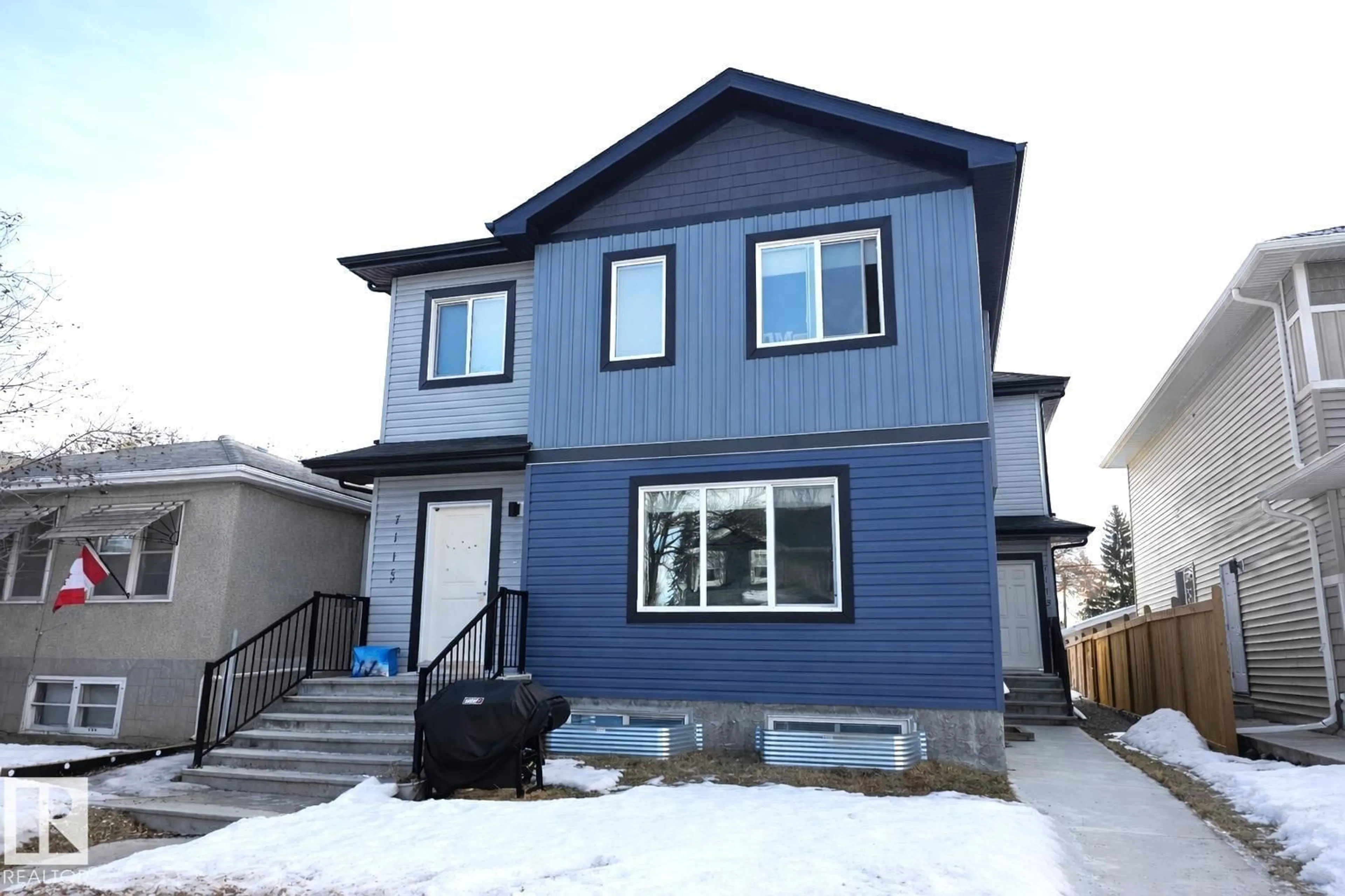 Home with vinyl exterior material, street for NW - 7113 / 7115 106 ST, Edmonton Alberta T6E4V5