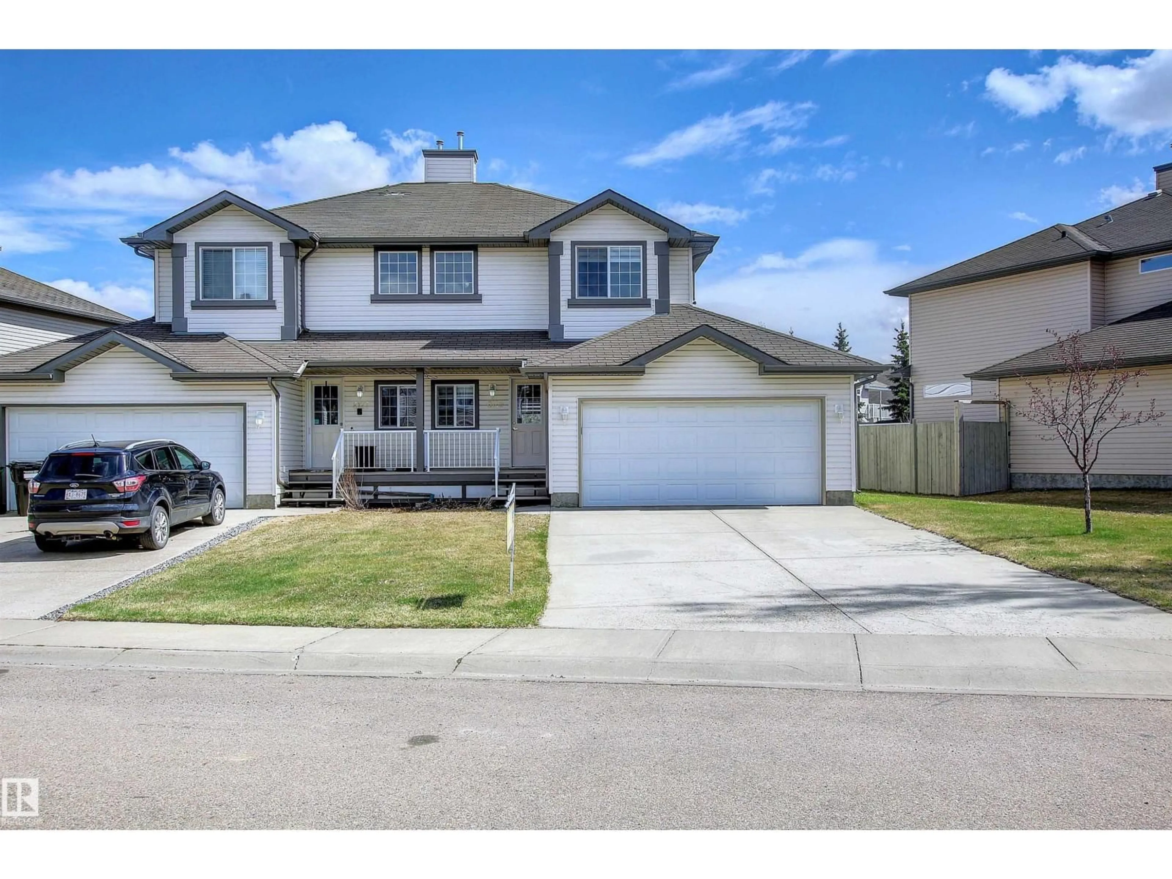 Home with vinyl exterior material, street for 8129 7 AV, Edmonton Alberta T6X1L9