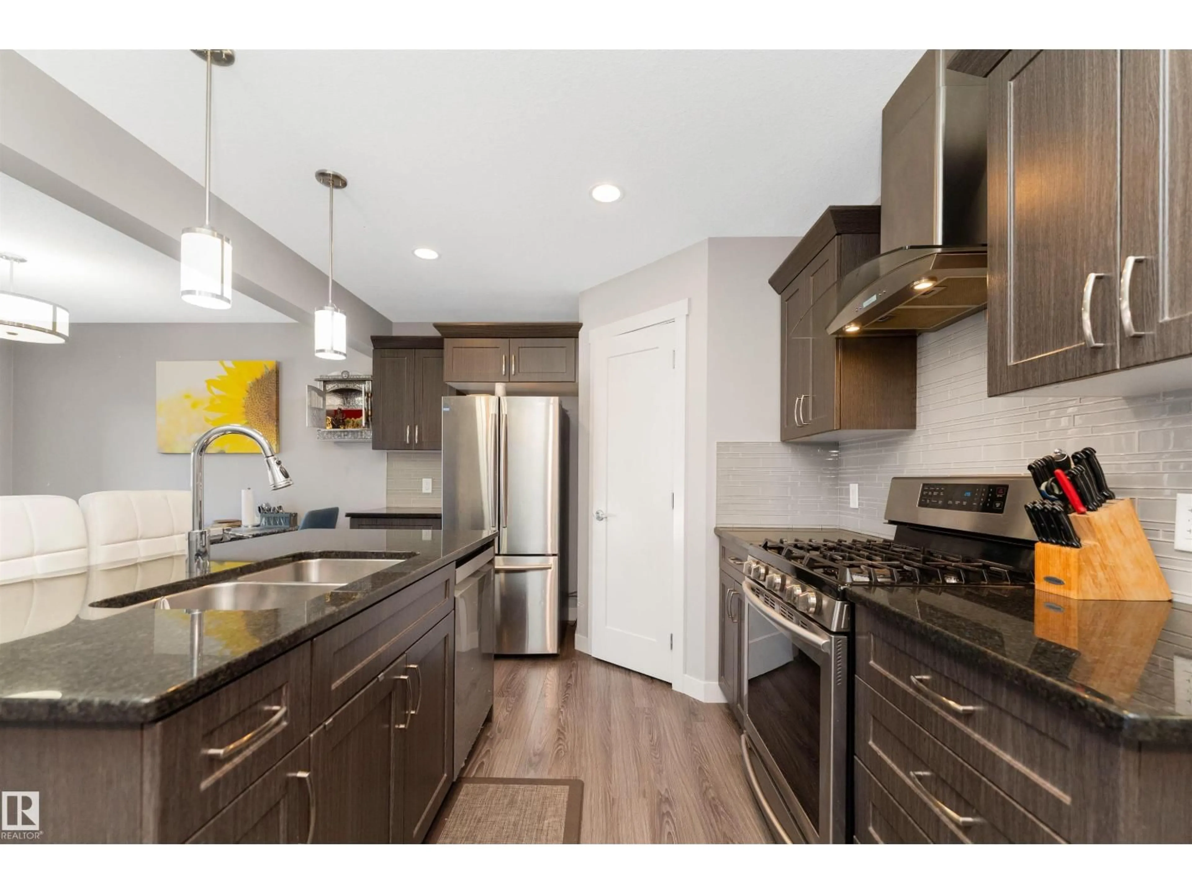 Open concept kitchen, wood/laminate floor for SW - 1728 167 ST, Edmonton Alberta T6W3C5