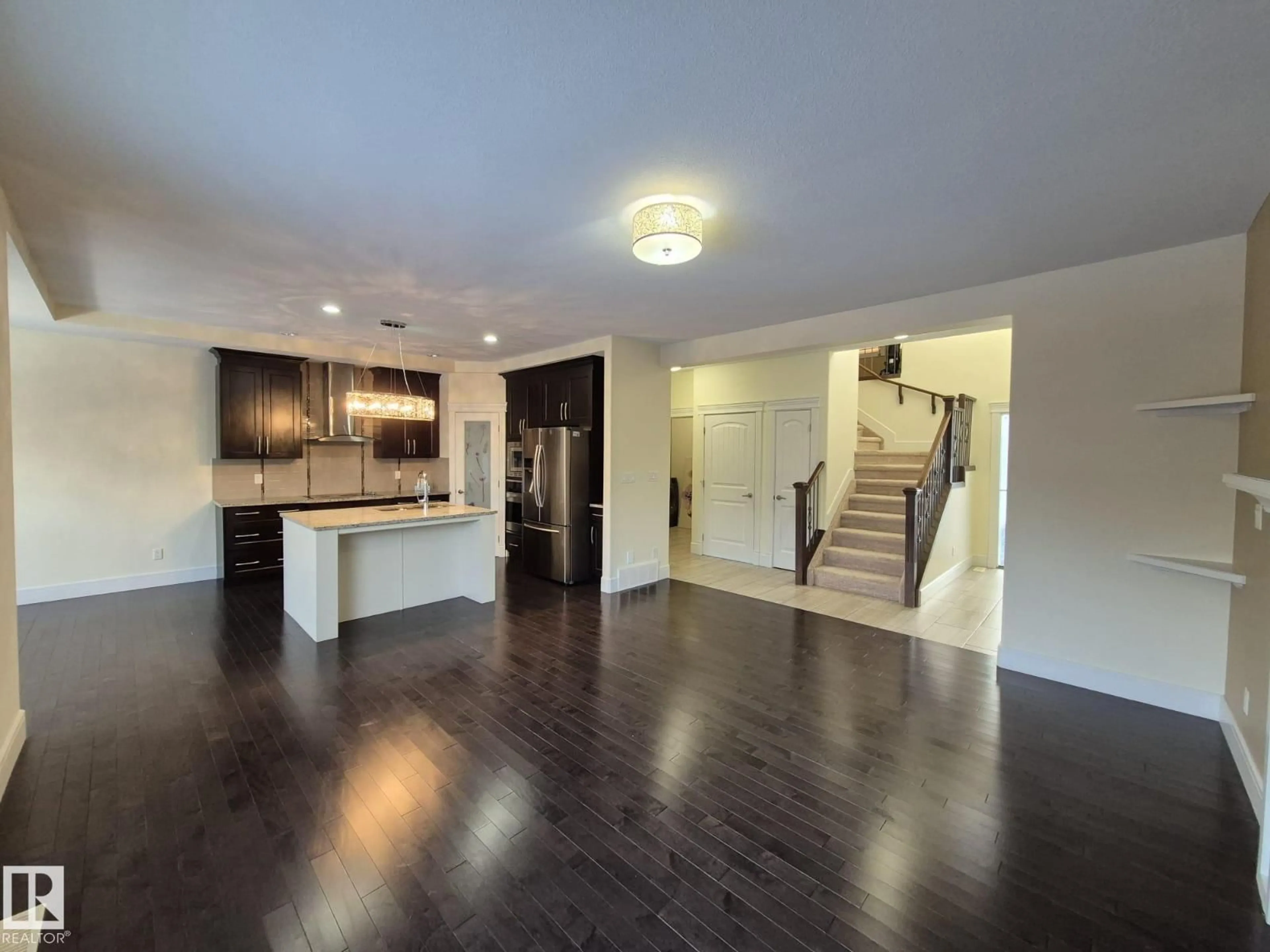 Open concept kitchen, wood/laminate floor for 1737 52A ST, Edmonton Alberta T6X1Y1