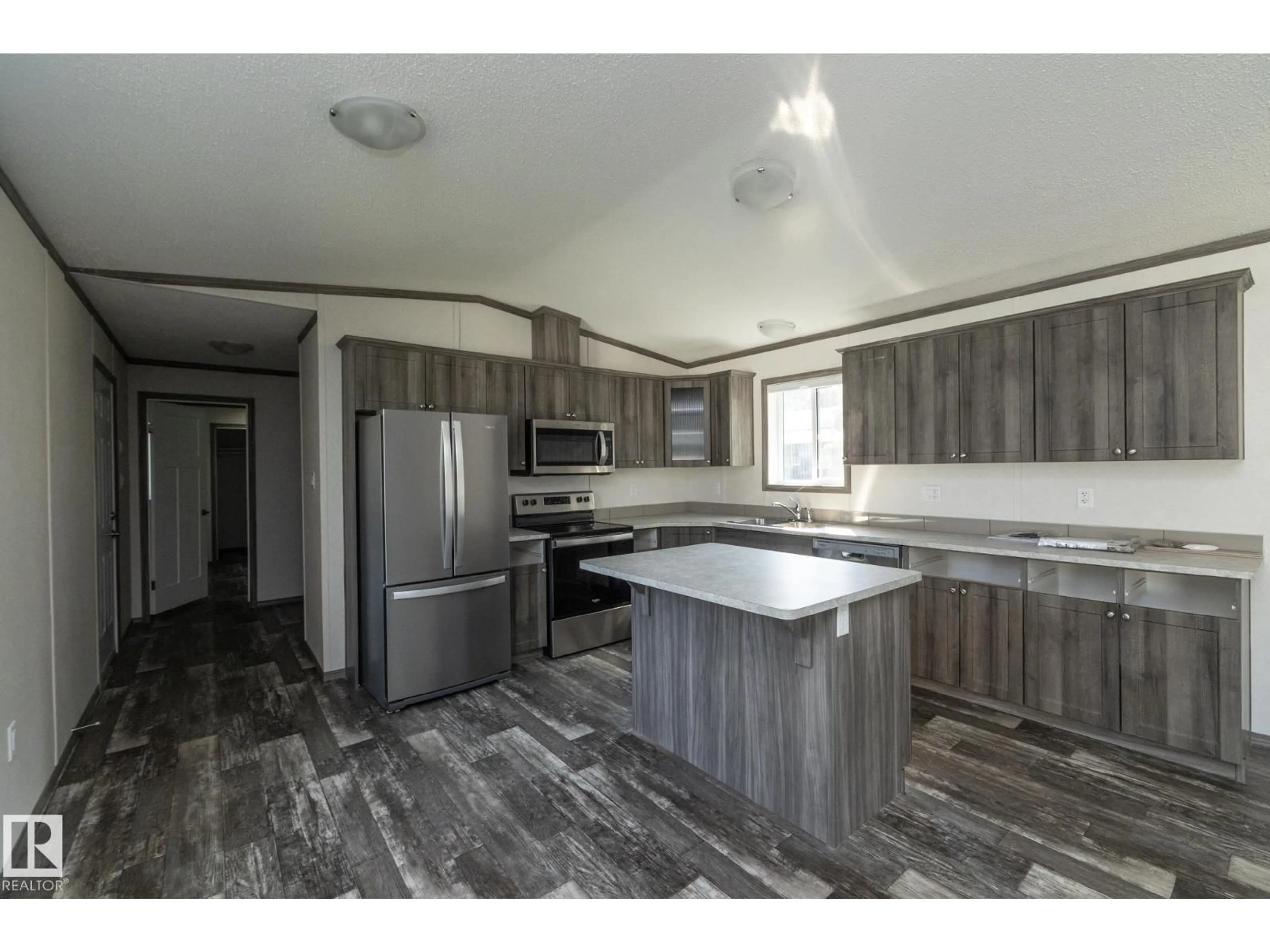 Open concept kitchen, wood/laminate floor for 74 WILLOW PARK ES, Leduc Alberta T9E5R5