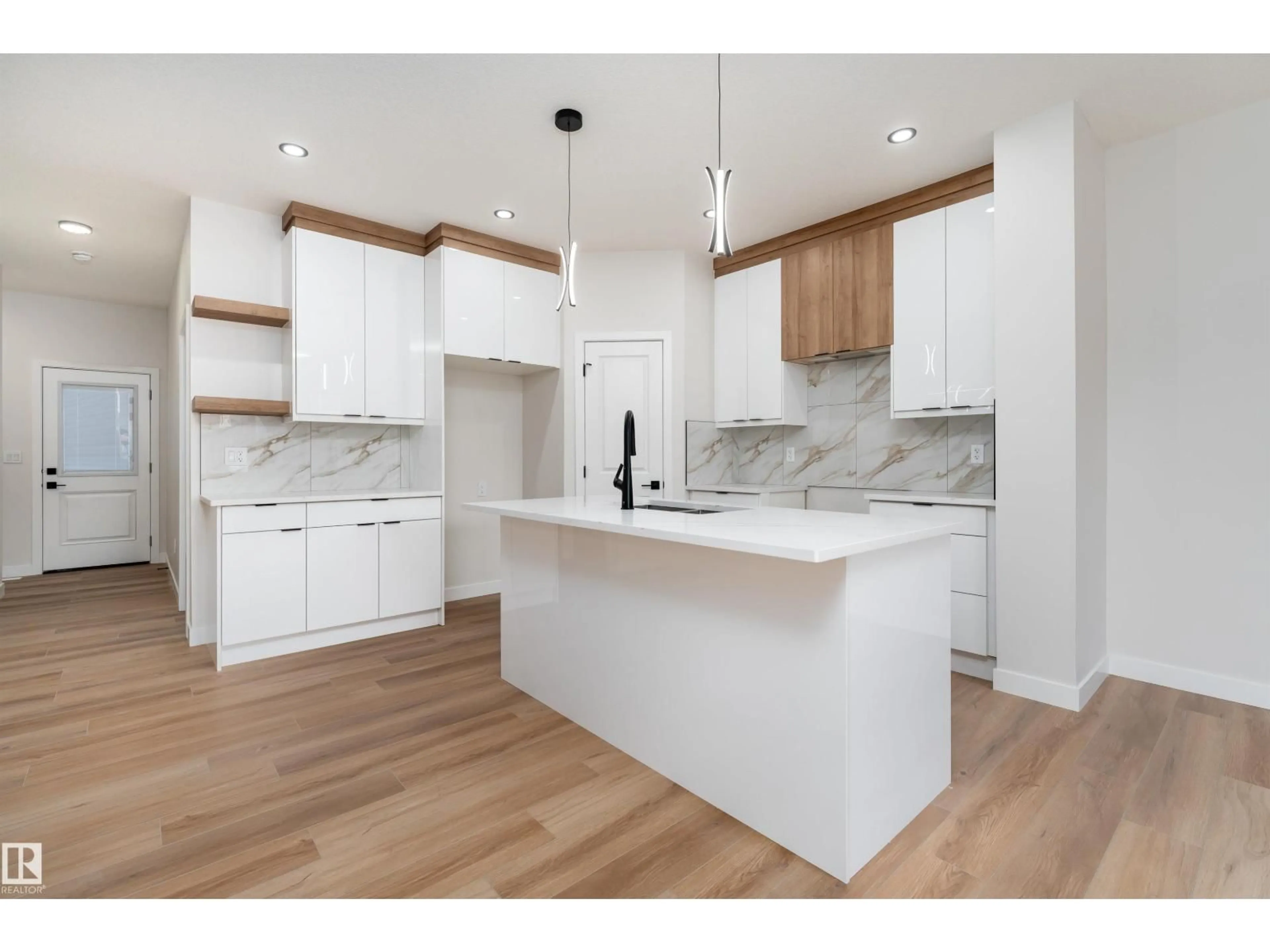 Open concept kitchen, wood/laminate floor for 30 WESTWYCK LI, Spruce Grove Alberta T7X3H1