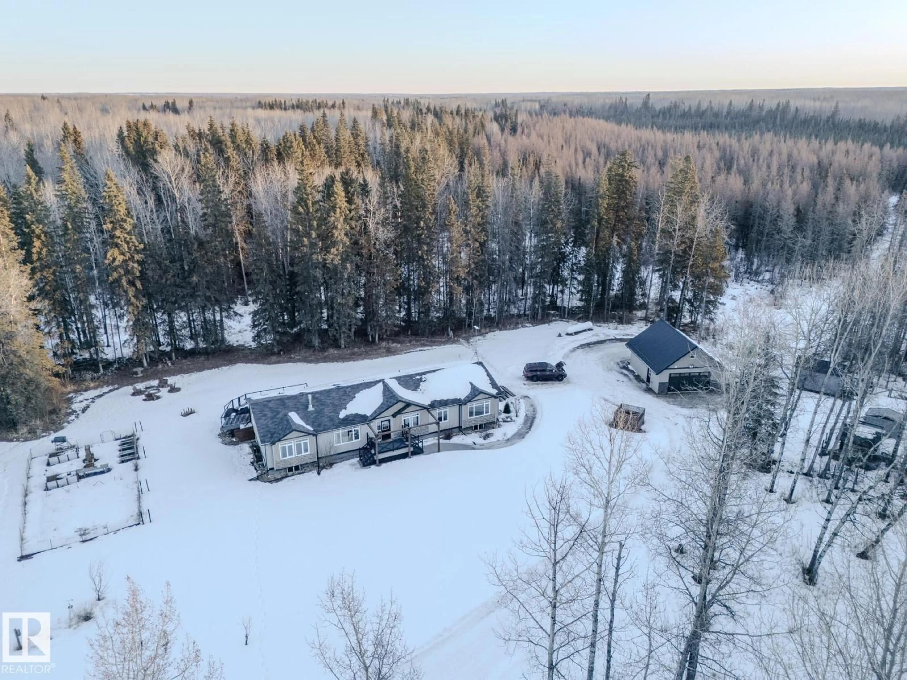 A pic from outside/outdoor area/front of a property/back of a property/a pic from drone, forest/trees view for 54501 RGE ROAD 62, Rural Lac Ste. Anne County Alberta T7X0O0