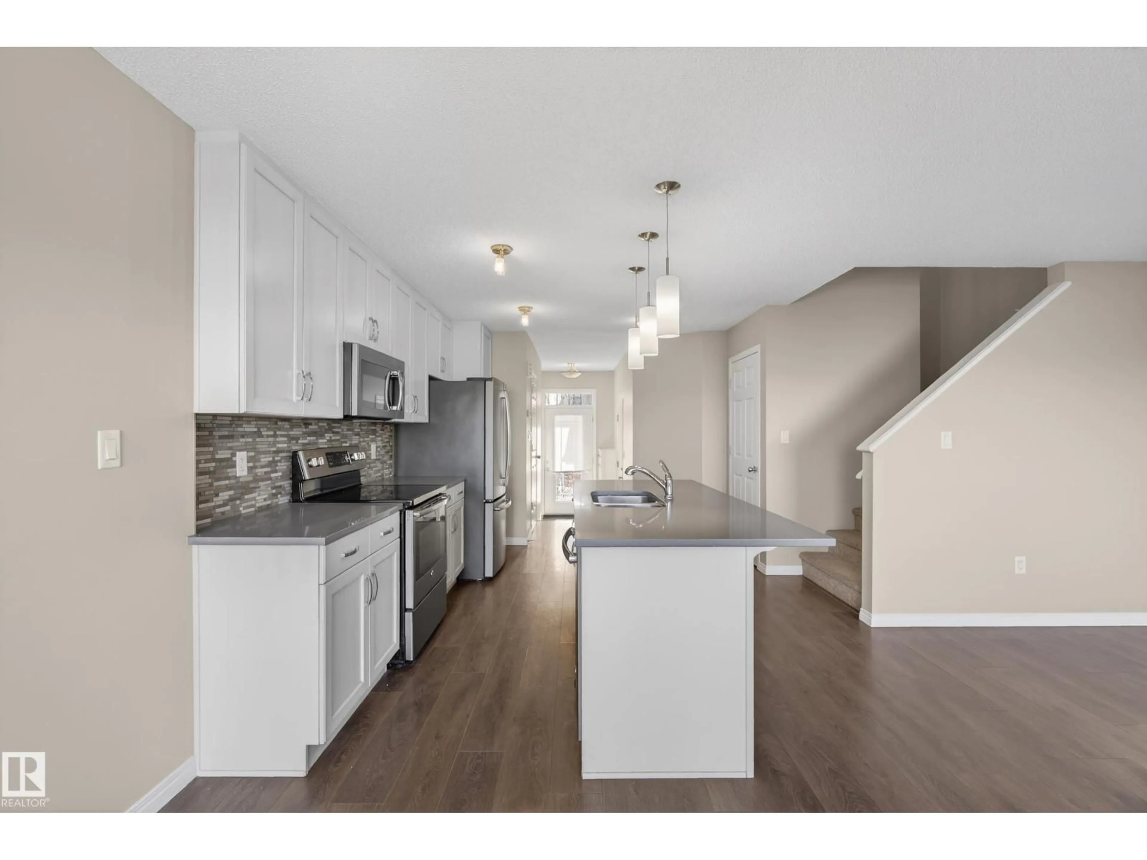 Open concept kitchen, wood/laminate floor for 2786 COUGHLAN GR, Edmonton Alberta T6W3N9