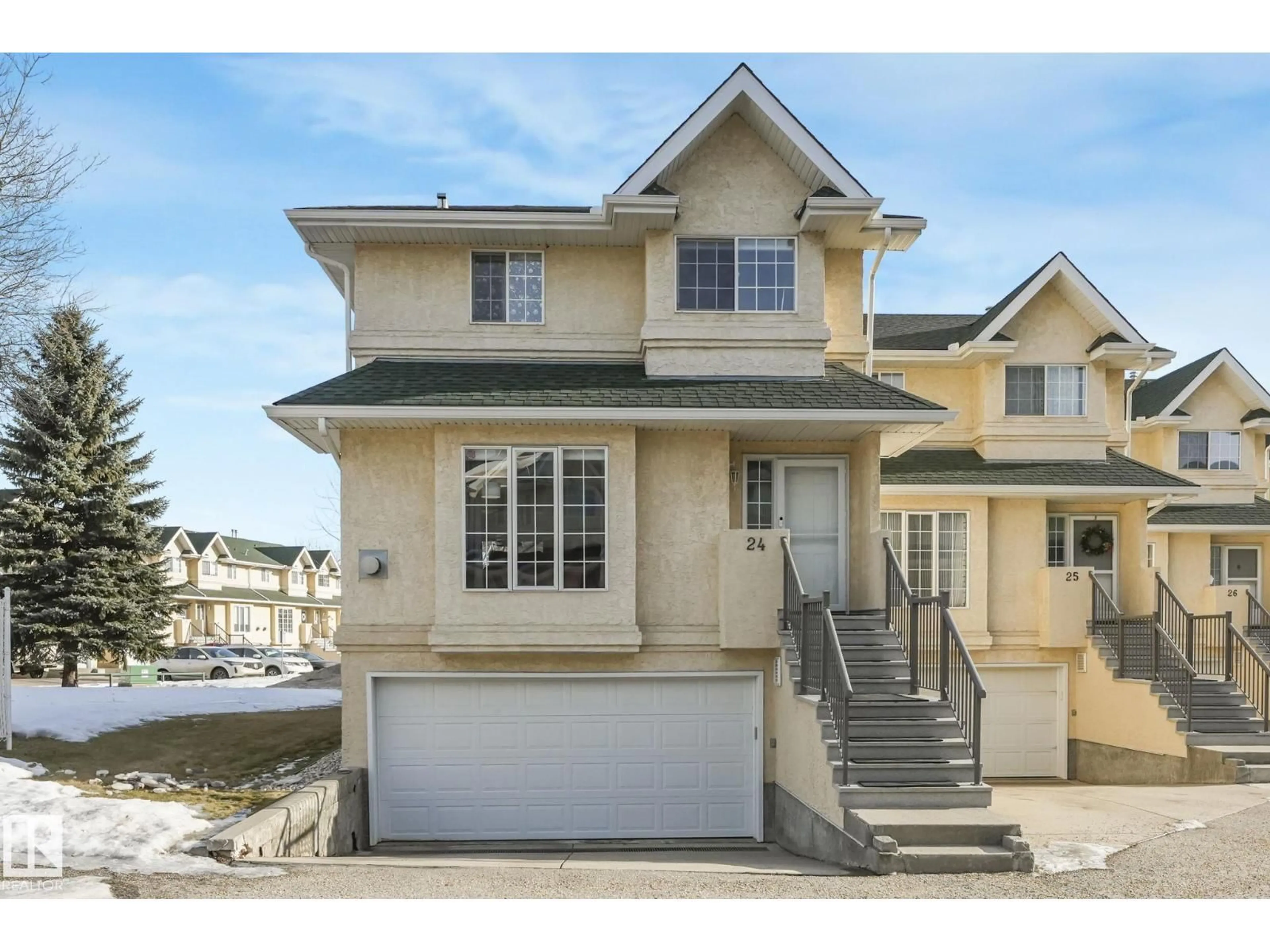 Home with vinyl exterior material, street for 24 - 2419 133 AV, Edmonton Alberta T5A5A5