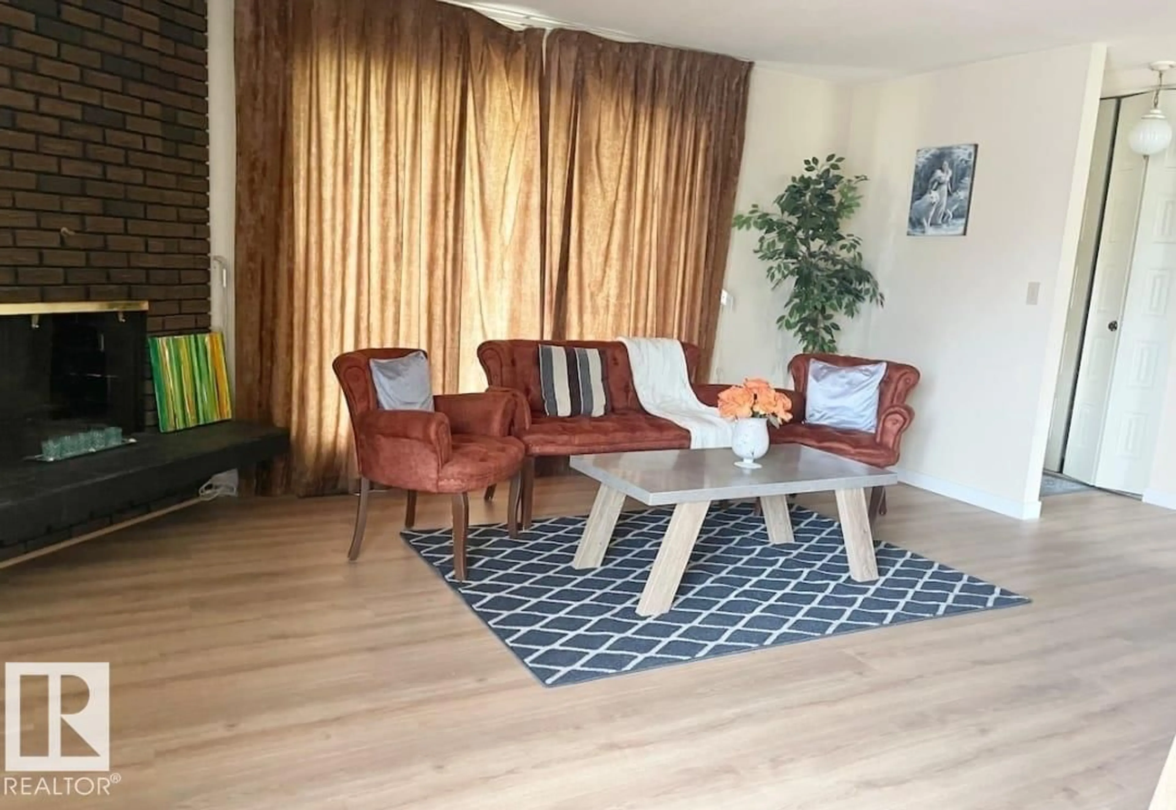 Living room with furniture, wood/laminate floor for 14139 30 ST, Edmonton Alberta T5Y1M6