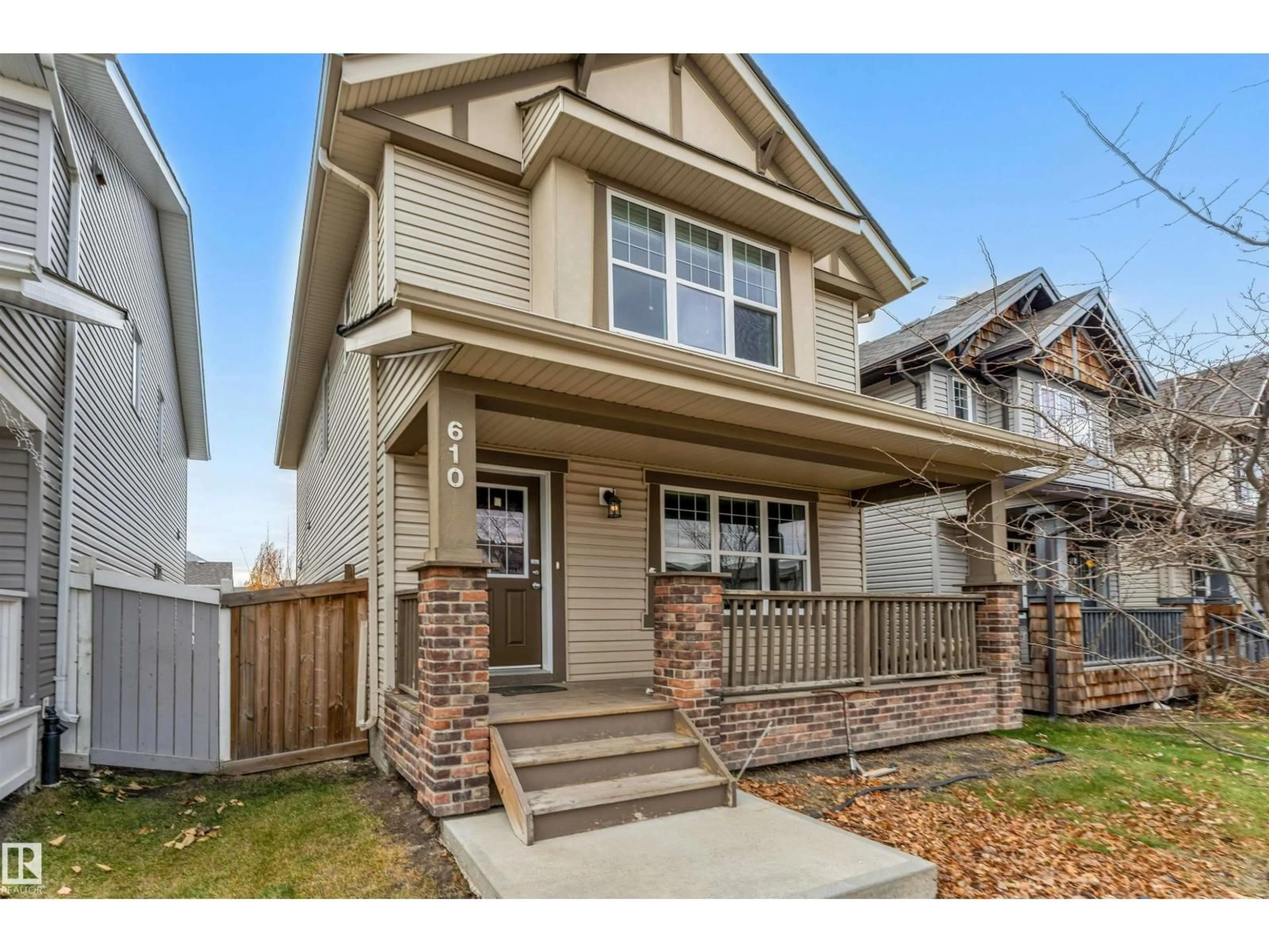 Home with vinyl exterior material, street for 610 TAMARACK RD, Edmonton Alberta T6T0M8