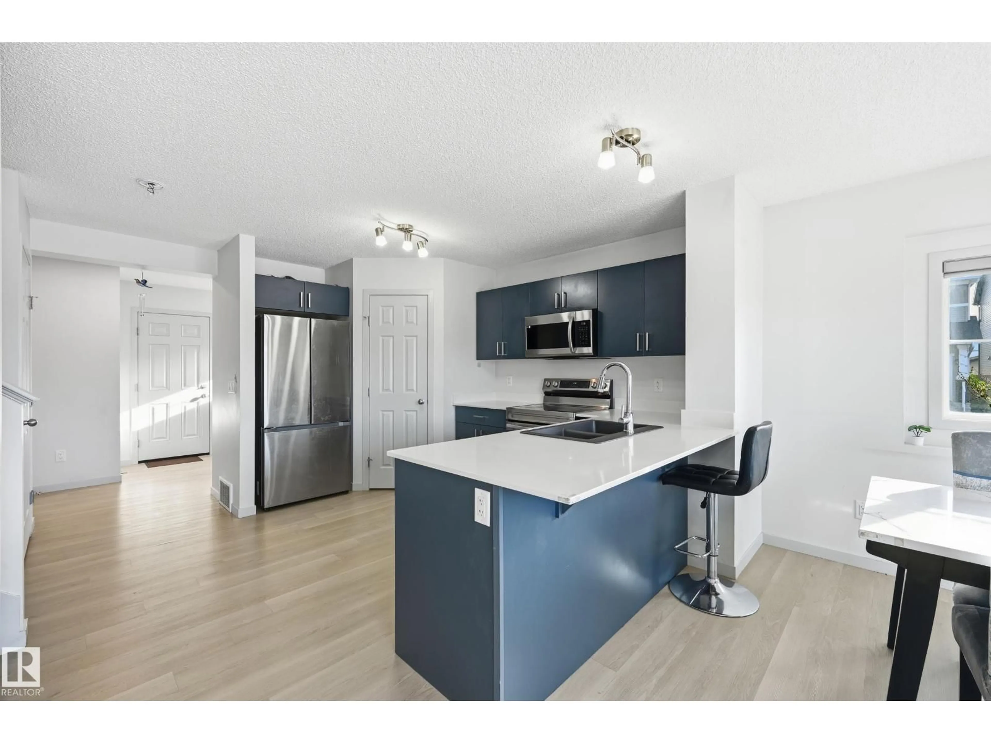 Open concept kitchen, unknown for NW - 9804 227 ST, Edmonton Alberta T5T7T9