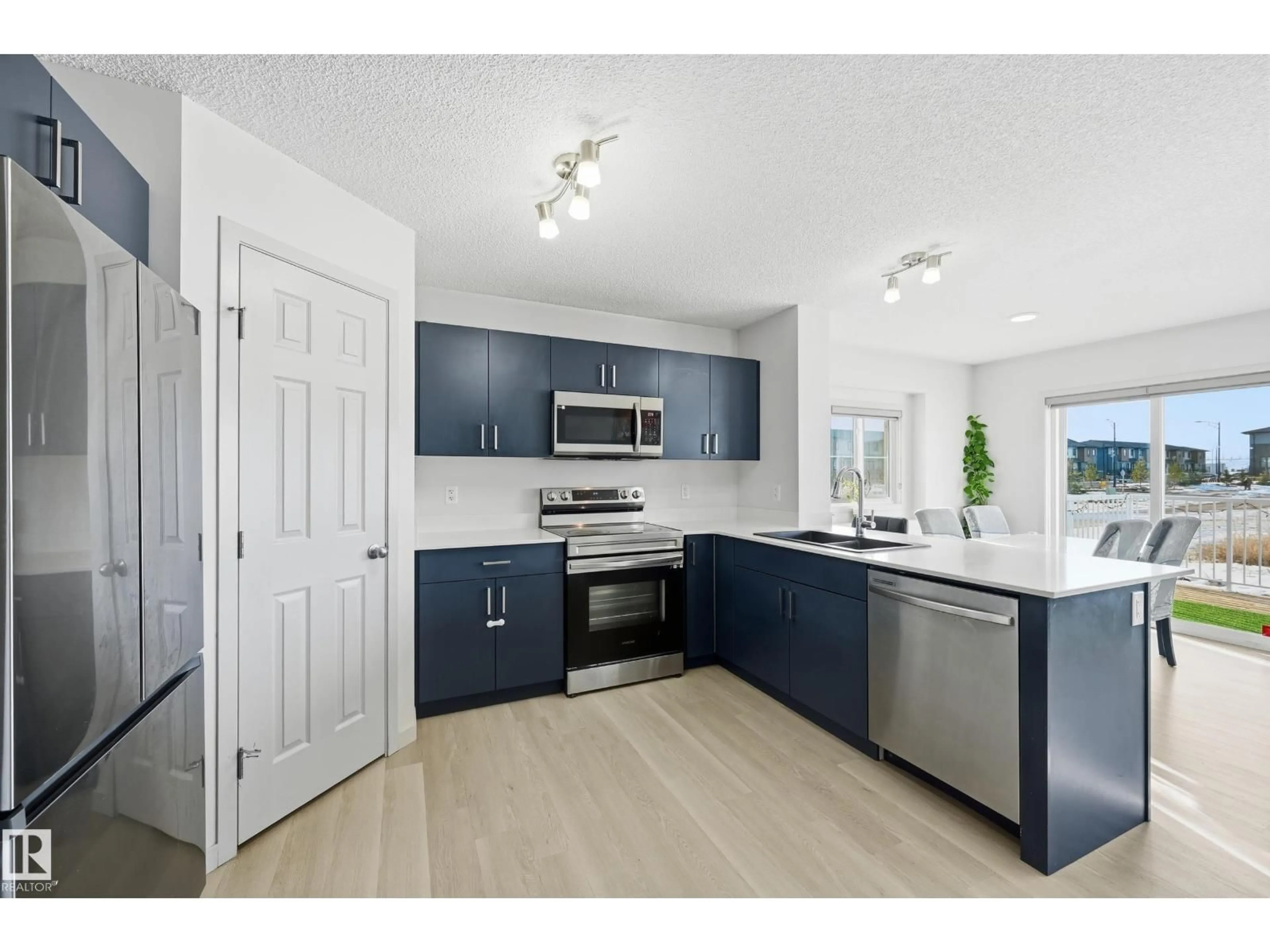Open concept kitchen, unknown for NW - 9804 227 ST, Edmonton Alberta T5T7T9
