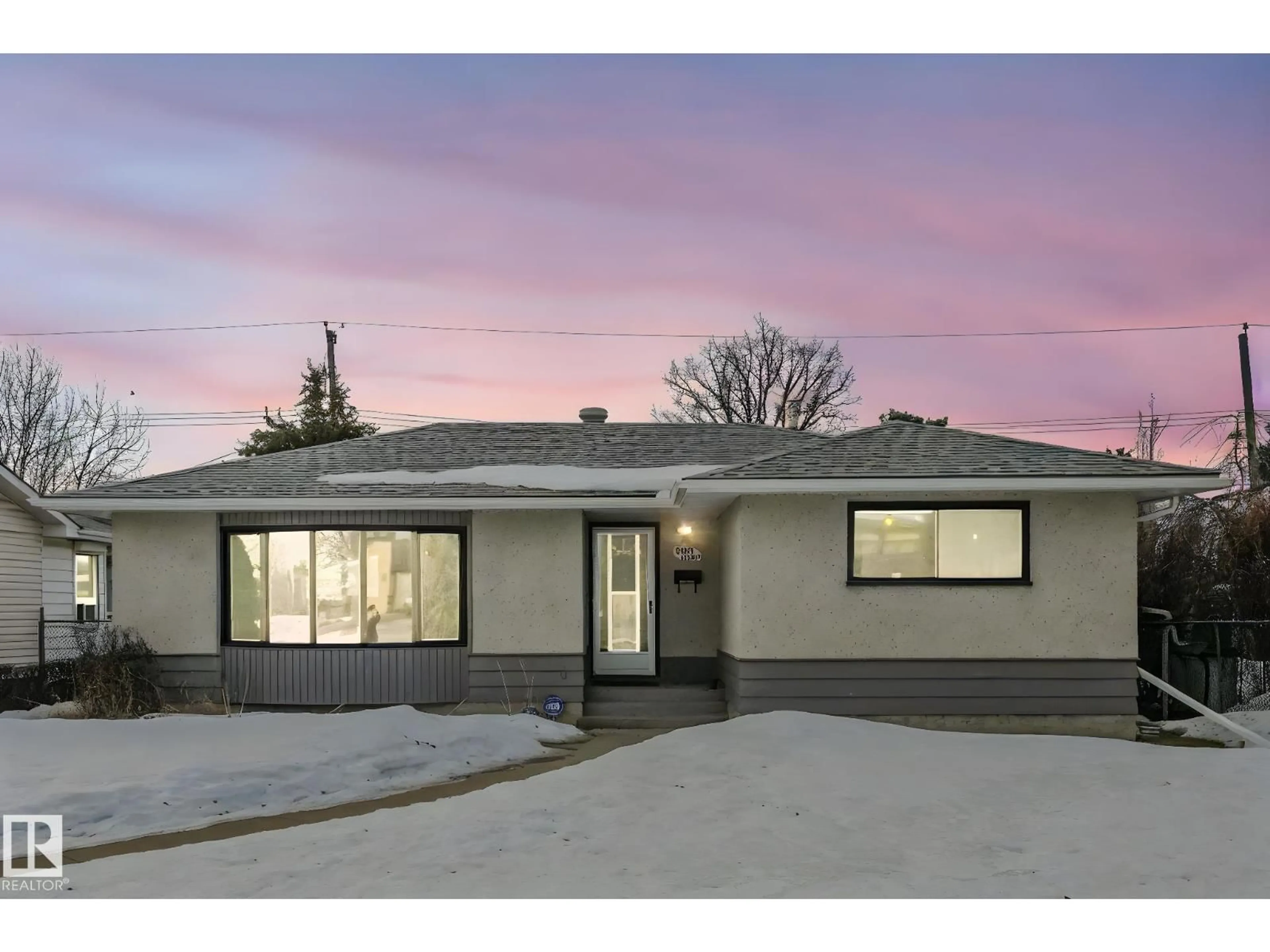 Home with vinyl exterior material, street for 9007 135 AV NW, Edmonton Alberta T5E1N5