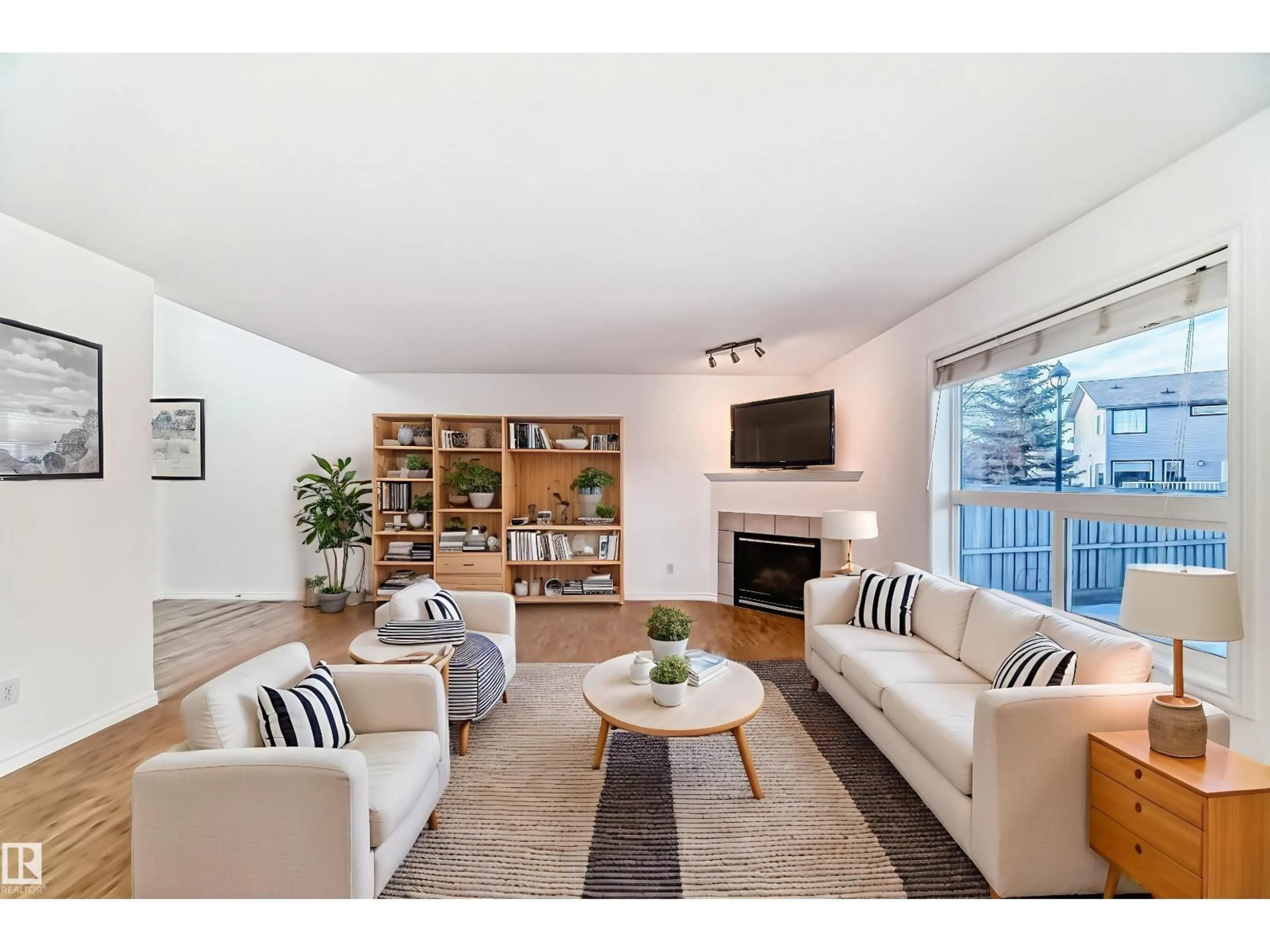 Living room with furniture, wood/laminate floor for NW - 4604 202 ST, Edmonton Alberta T6M2Y1