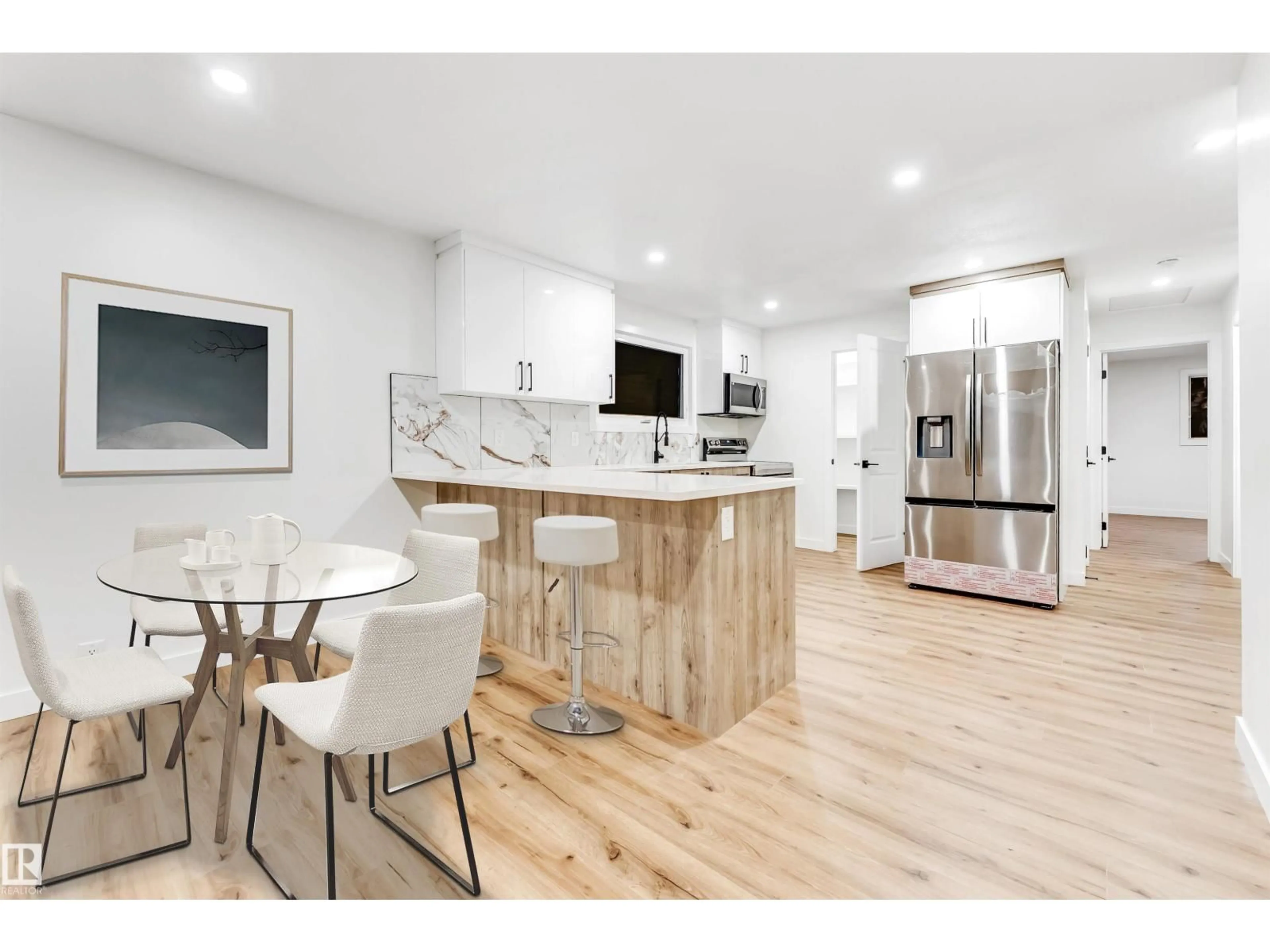 Open concept kitchen, wood/laminate floor for 4616 32 AV, Edmonton Alberta T6L4K9