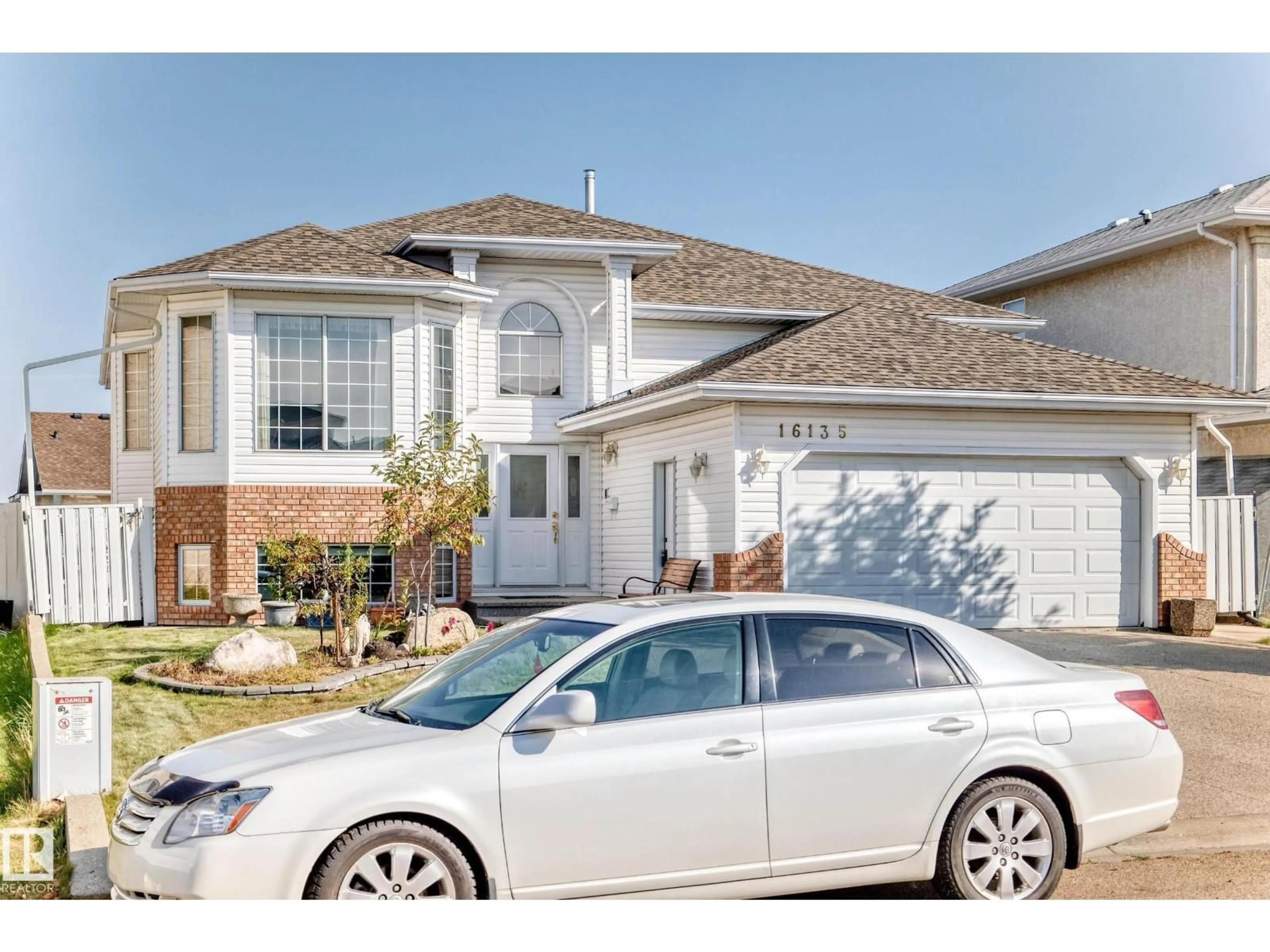 Home with vinyl exterior material, street for 16135 56 ST, Edmonton Alberta T5Y2T9