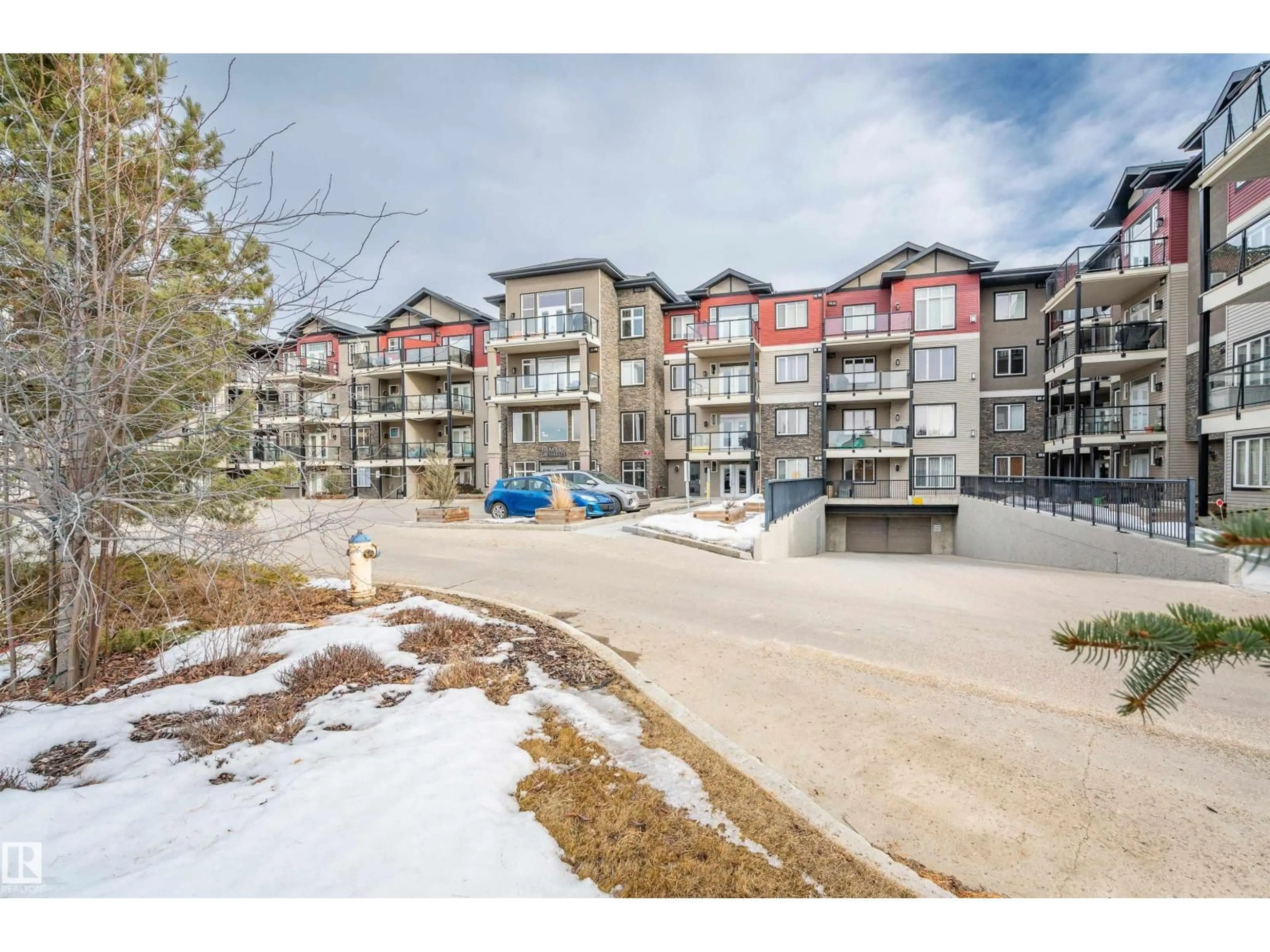 A pic from outside/outdoor area/front of a property/back of a property/a pic from drone, mountain view for #419 - 12408 15 AV, Edmonton Alberta T6W1X2