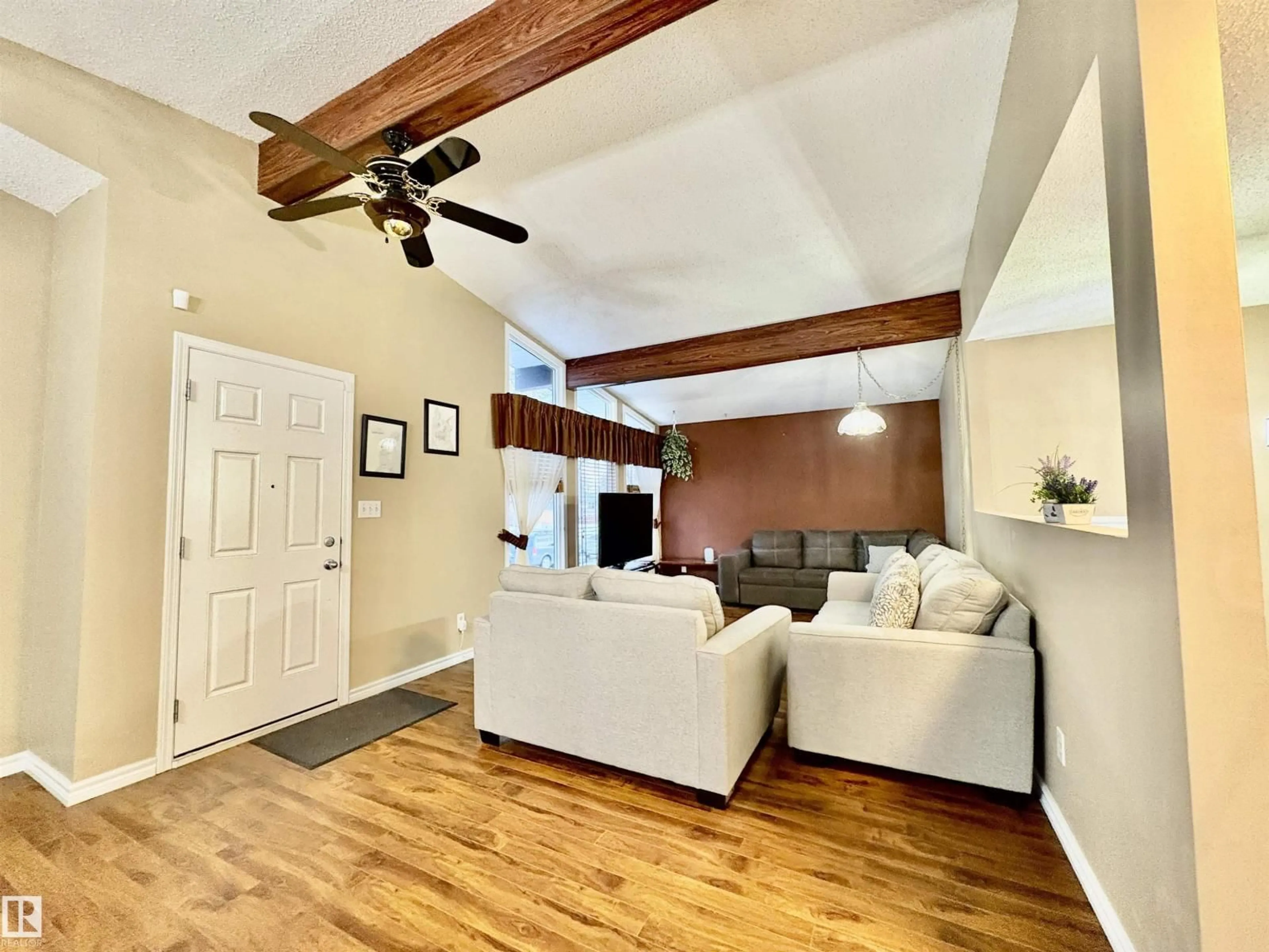 Living room with furniture, wood/laminate floor for NW - 11920 45 ST, Edmonton Alberta T5W2T6