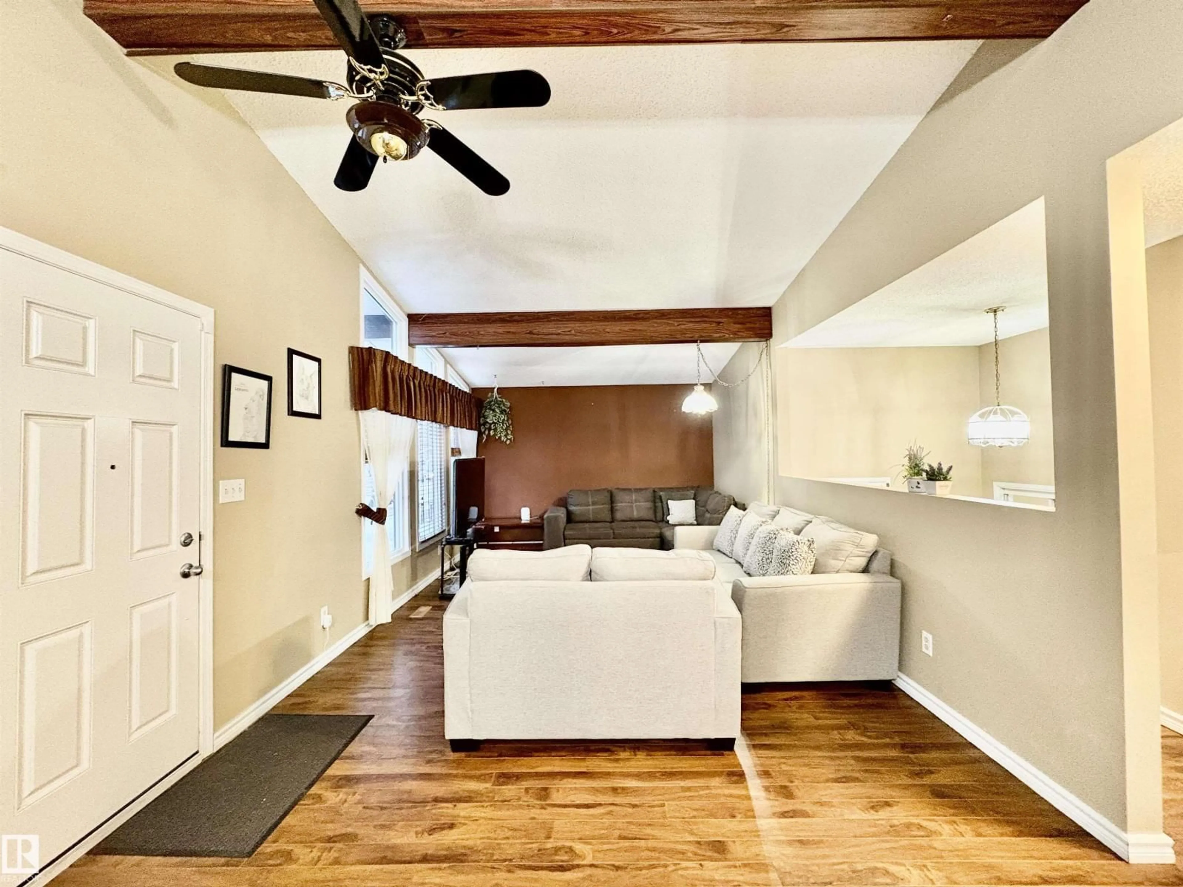 Living room with furniture, wood/laminate floor for NW - 11920 45 ST, Edmonton Alberta T5W2T6