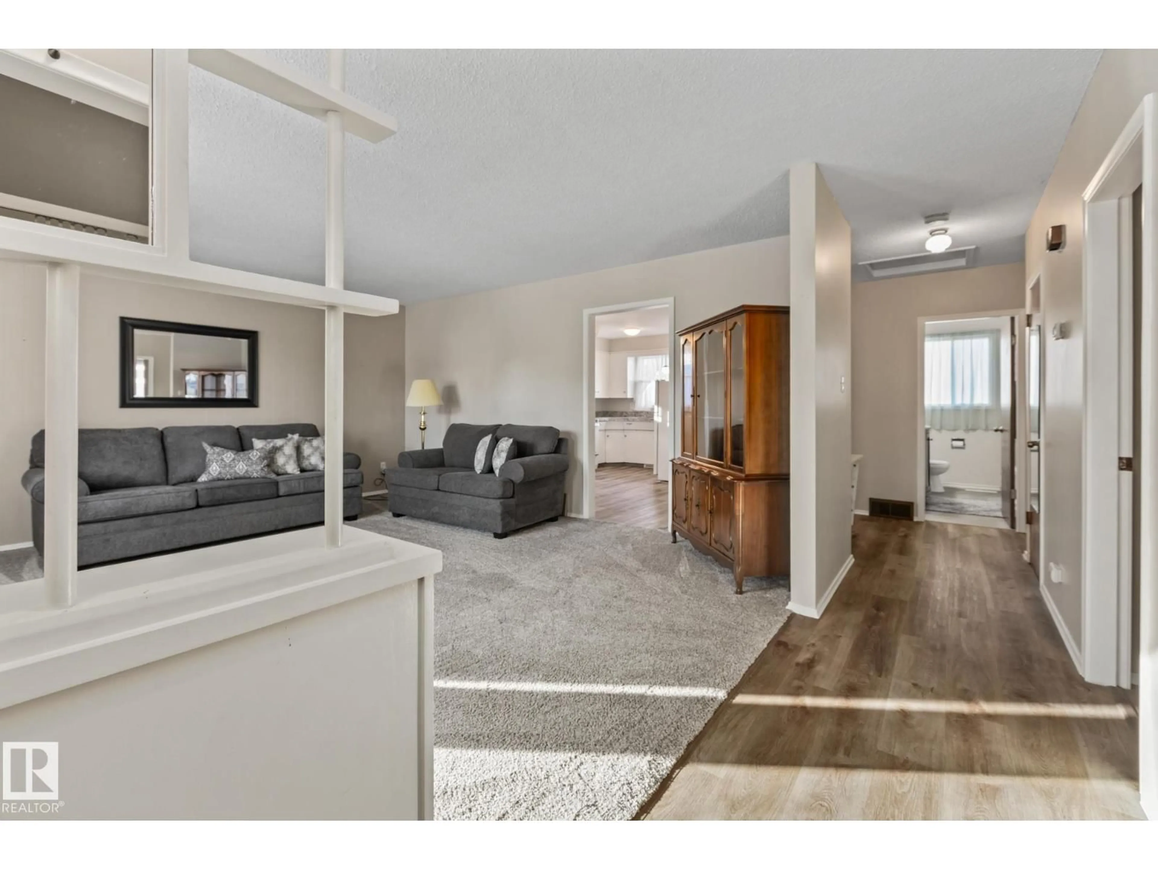 Living room with furniture, unknown for NW - 11926/11928 56 ST, Edmonton Alberta T5W3S9