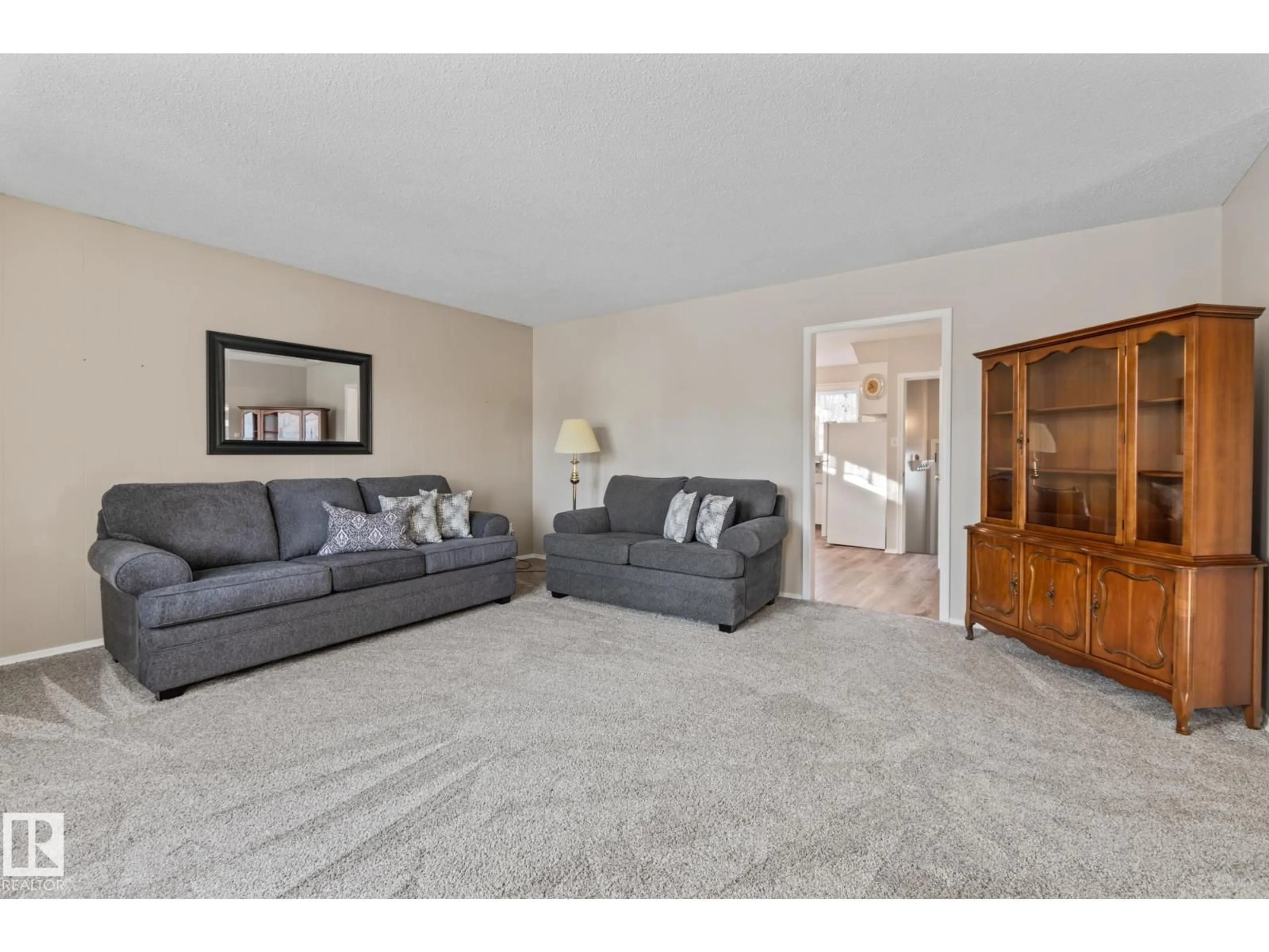Living room with furniture, carpet floor for NW - 11926/11928 56 ST, Edmonton Alberta T5W3S9