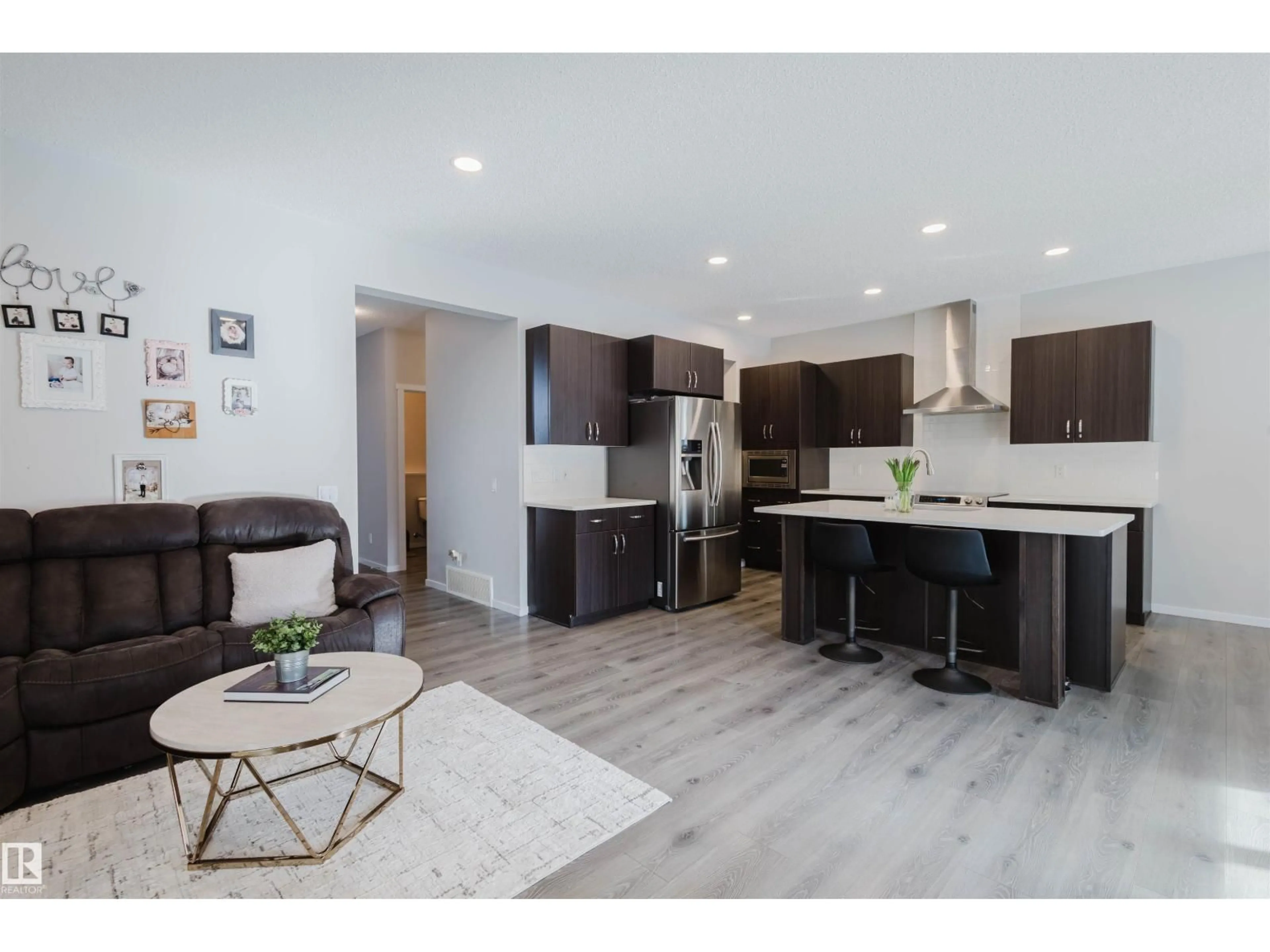 Open concept kitchen, wood/laminate floor for 20741 98A AV, Edmonton Alberta T5T7G2