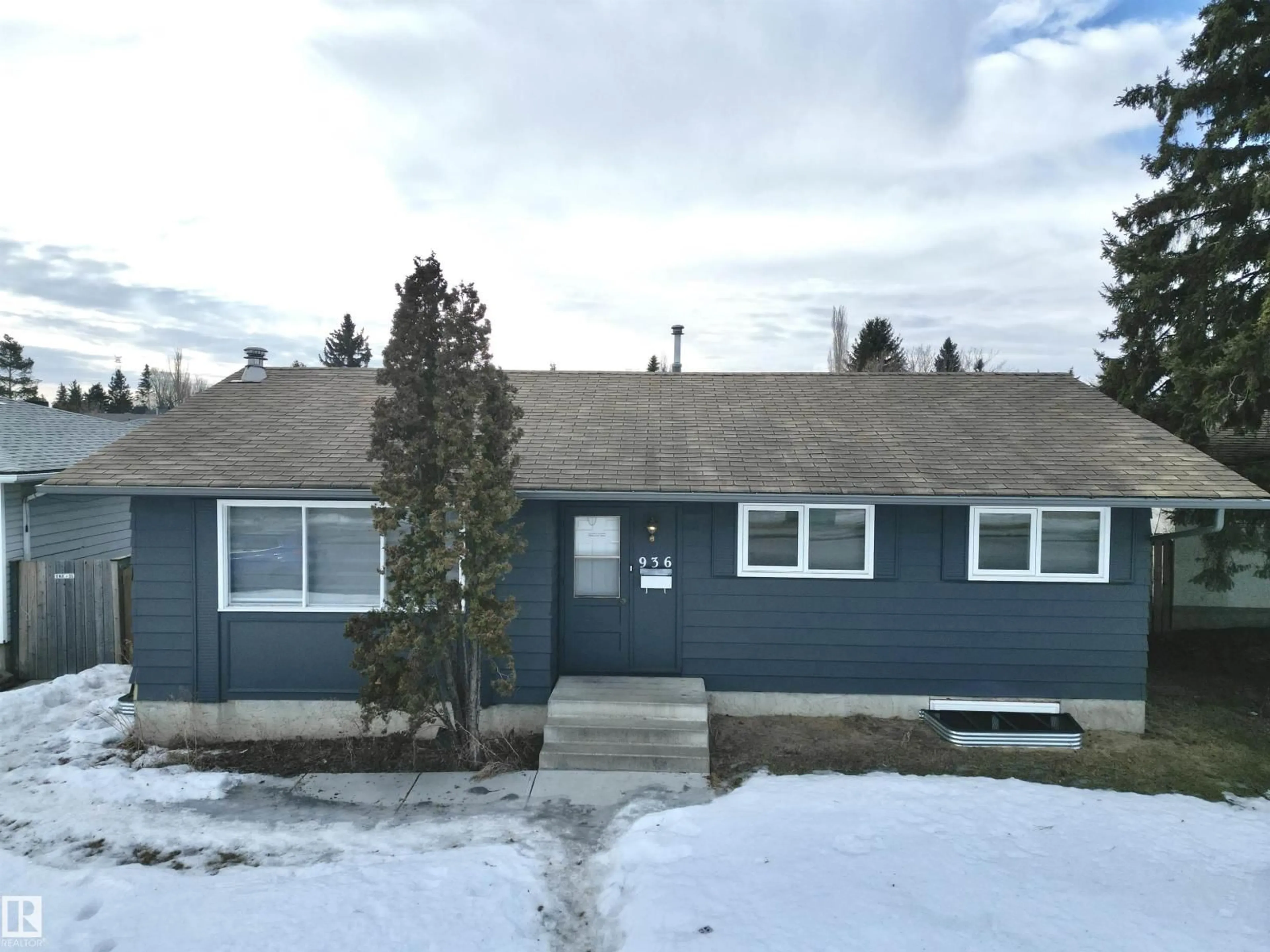 Home with vinyl exterior material, street for NW - 936 KNOTTWOOD RD S, Edmonton Alberta T6K3C2