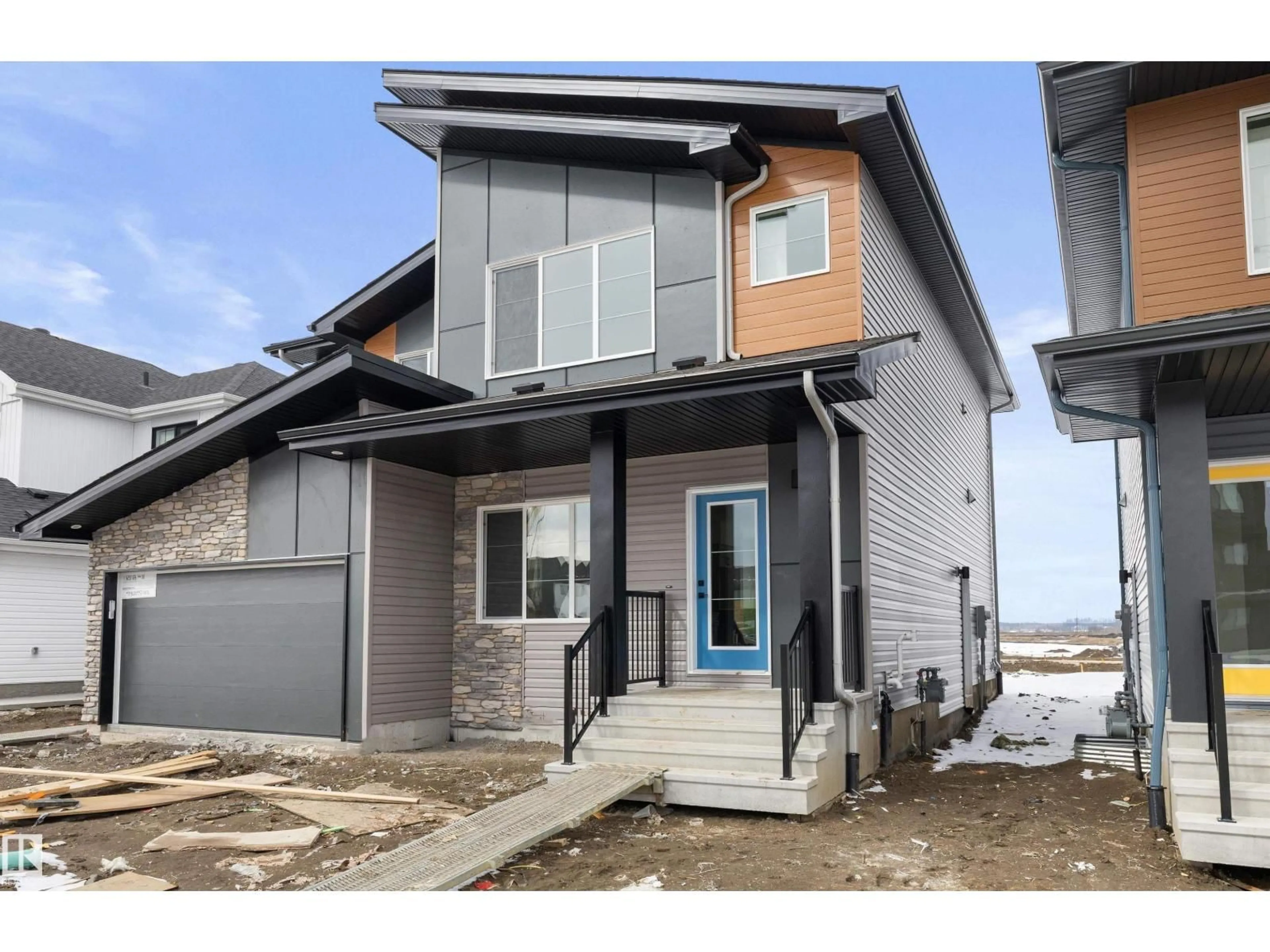 Home with vinyl exterior material, street for NE - 634 176 AV, Edmonton Alberta T5Y4K3