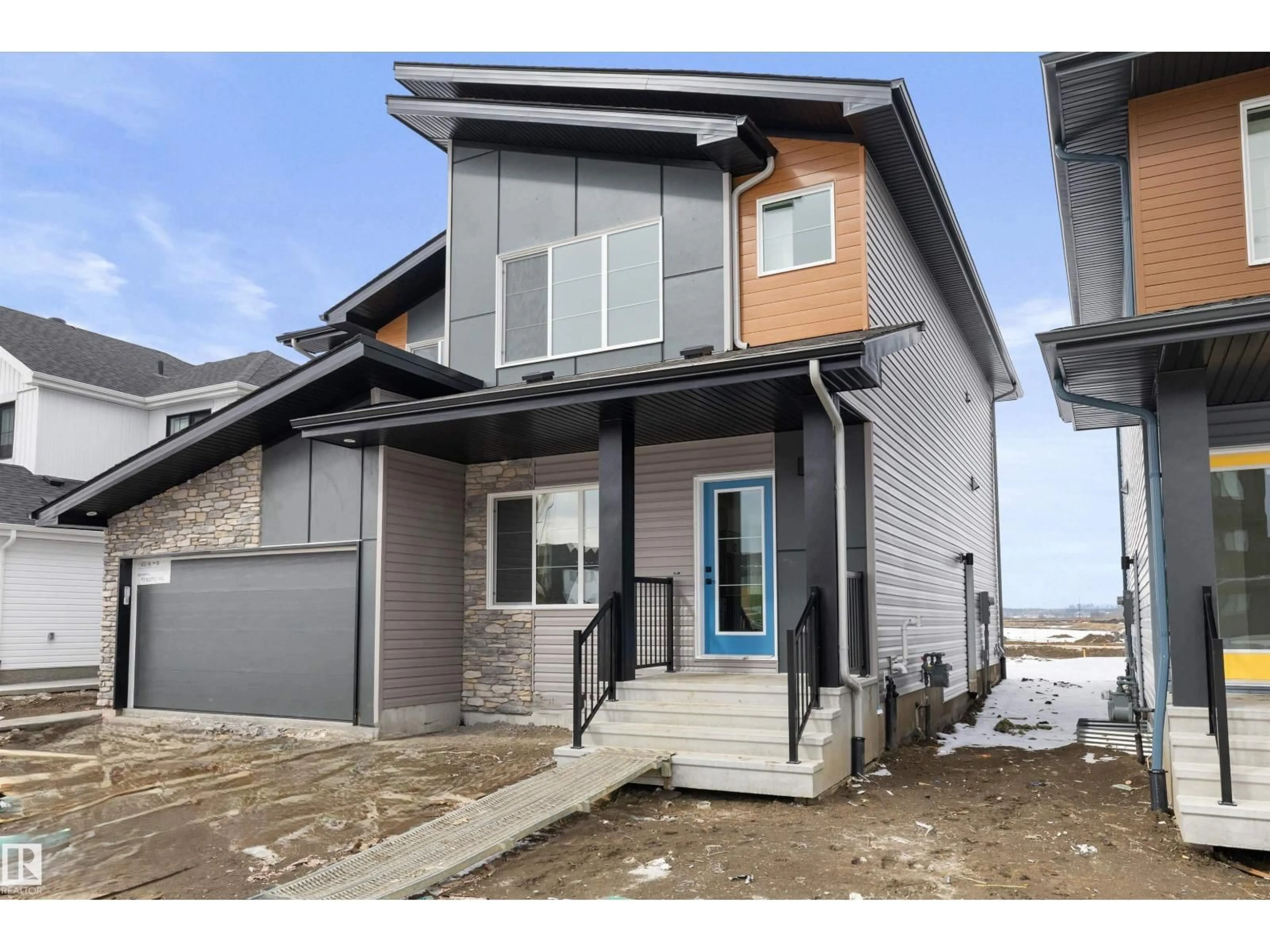 Home with vinyl exterior material, street for NE - 634 176 AV, Edmonton Alberta T5Y4K3