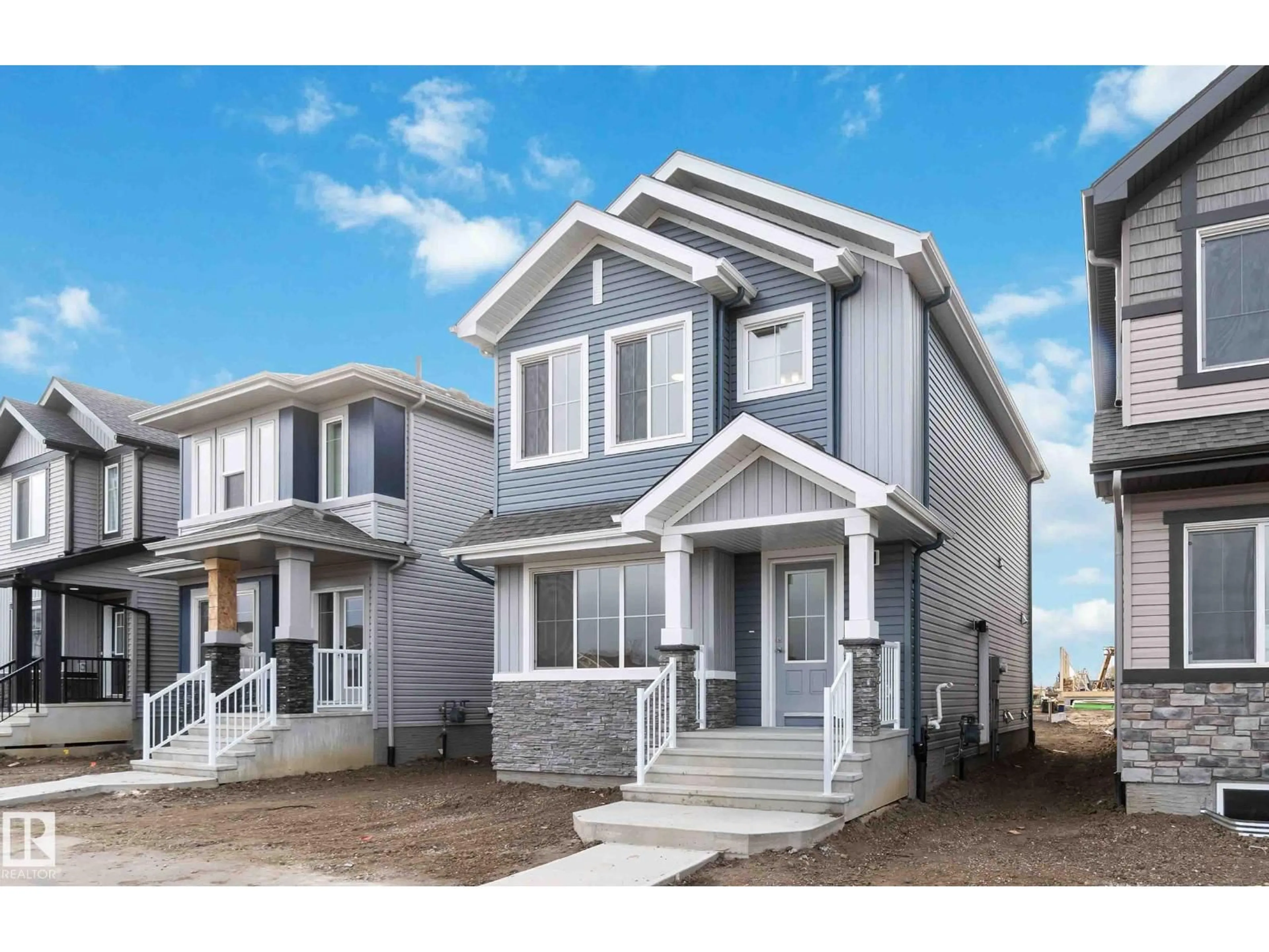 Home with vinyl exterior material, street for NE - 428 176 AV, Edmonton Alberta T5Y4J7