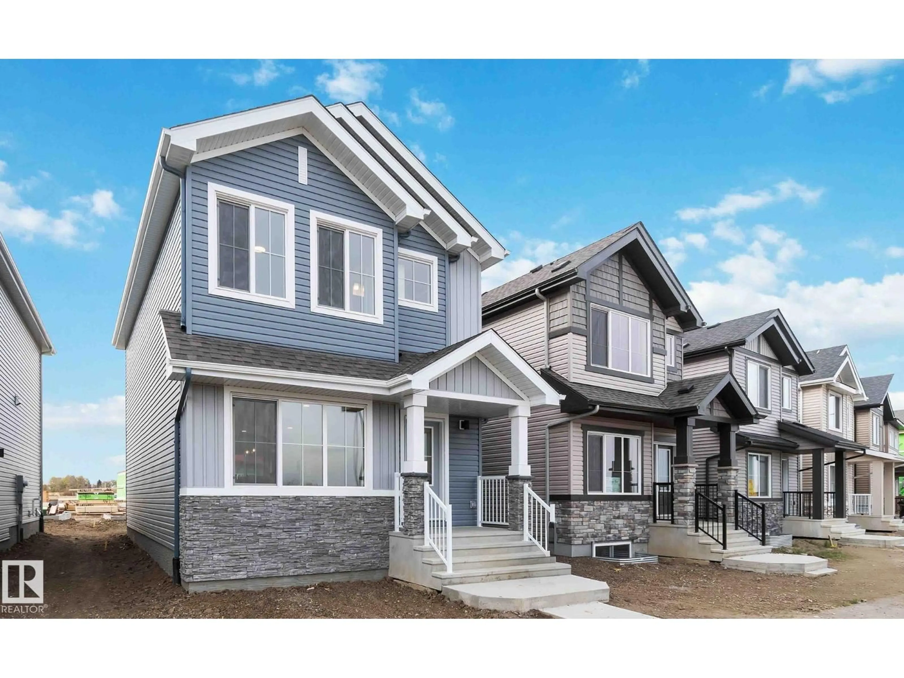 Home with vinyl exterior material, street for NE - 428 176 AV, Edmonton Alberta T5Y4J7