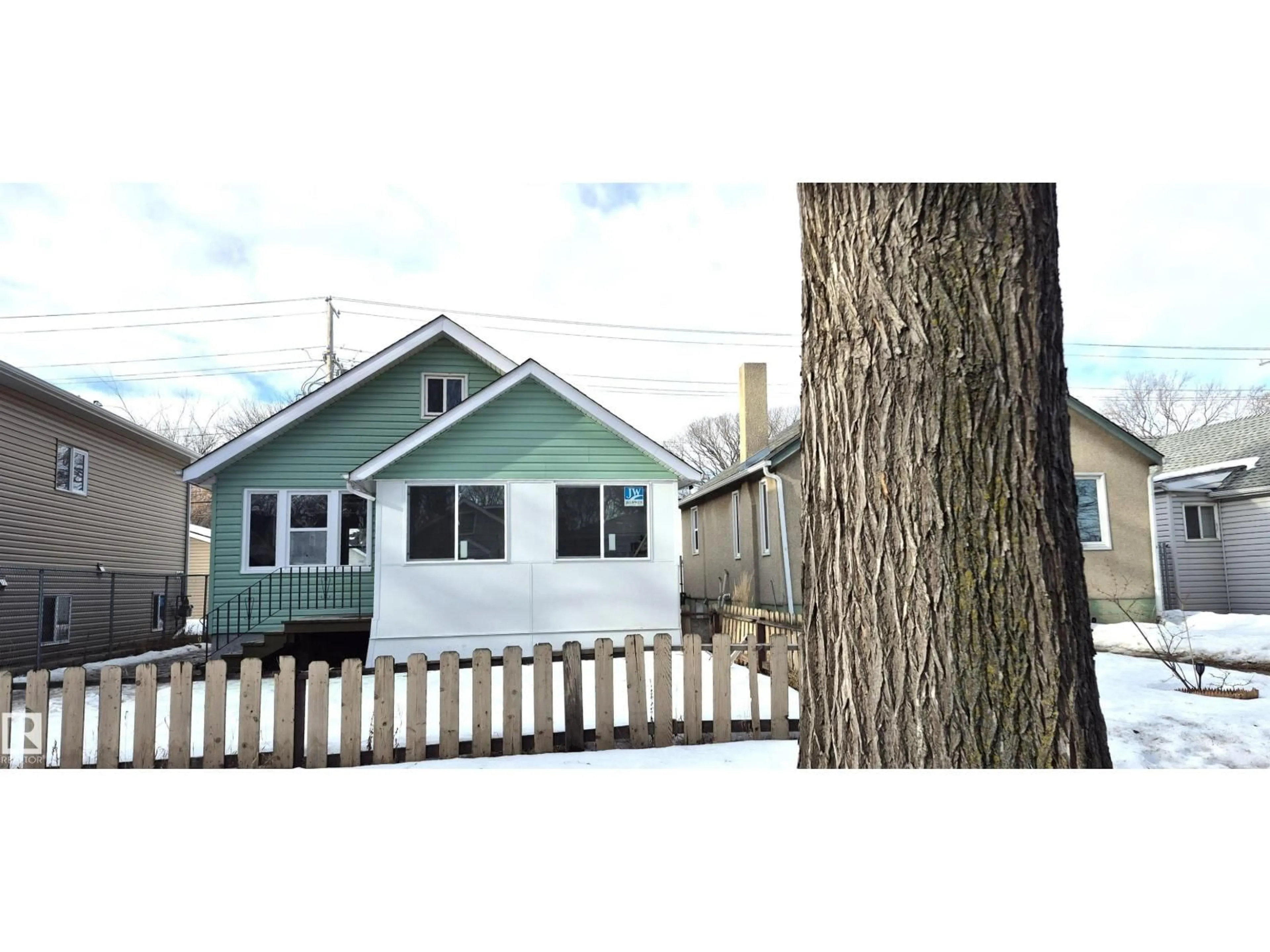 Home with vinyl exterior material, street for NW - 11426 84 ST, Edmonton Alberta T5B3B4