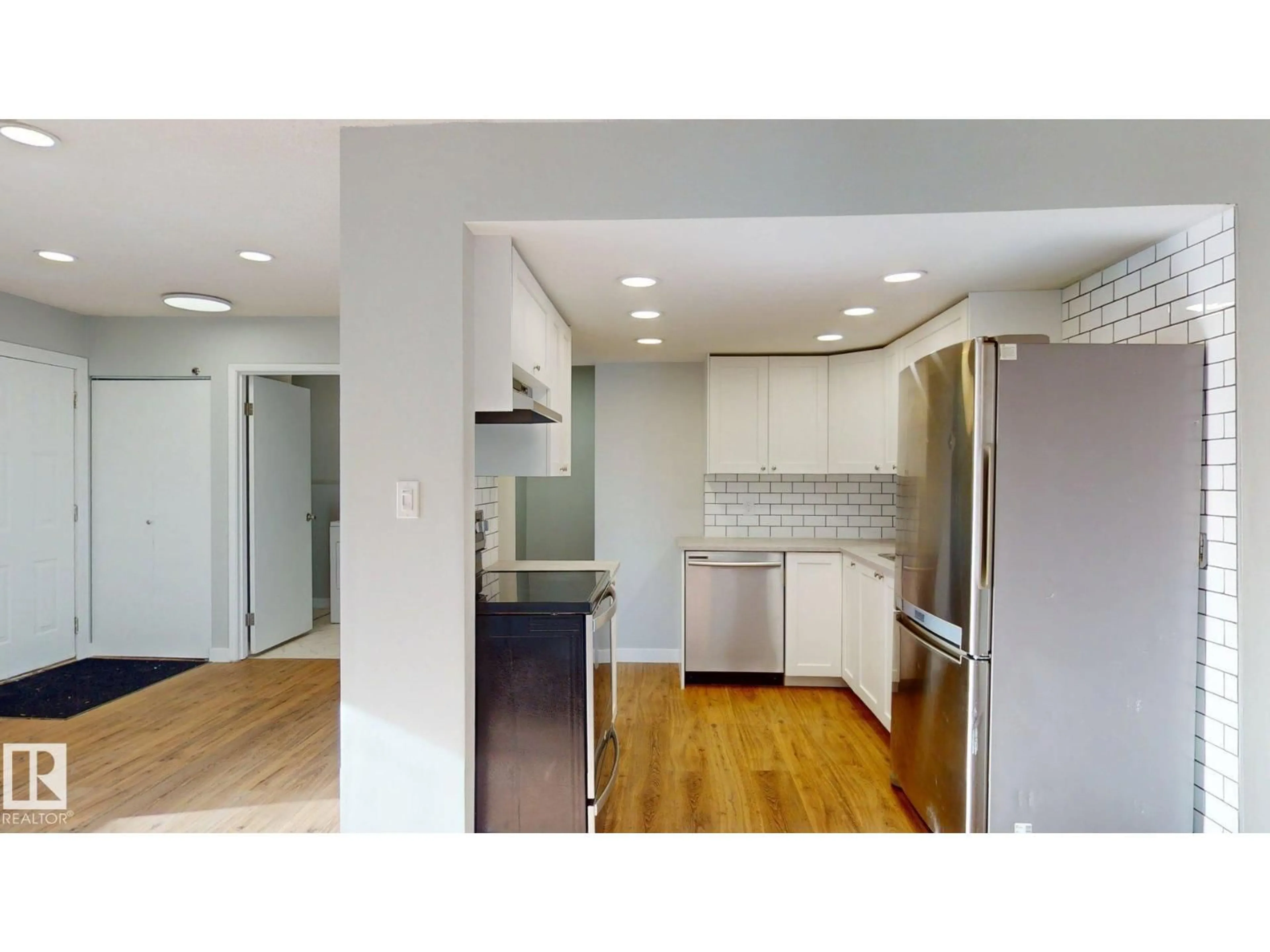 Open concept kitchen, wood/laminate floor for 611 - 2908 116A AV, Edmonton Alberta T8H1S1