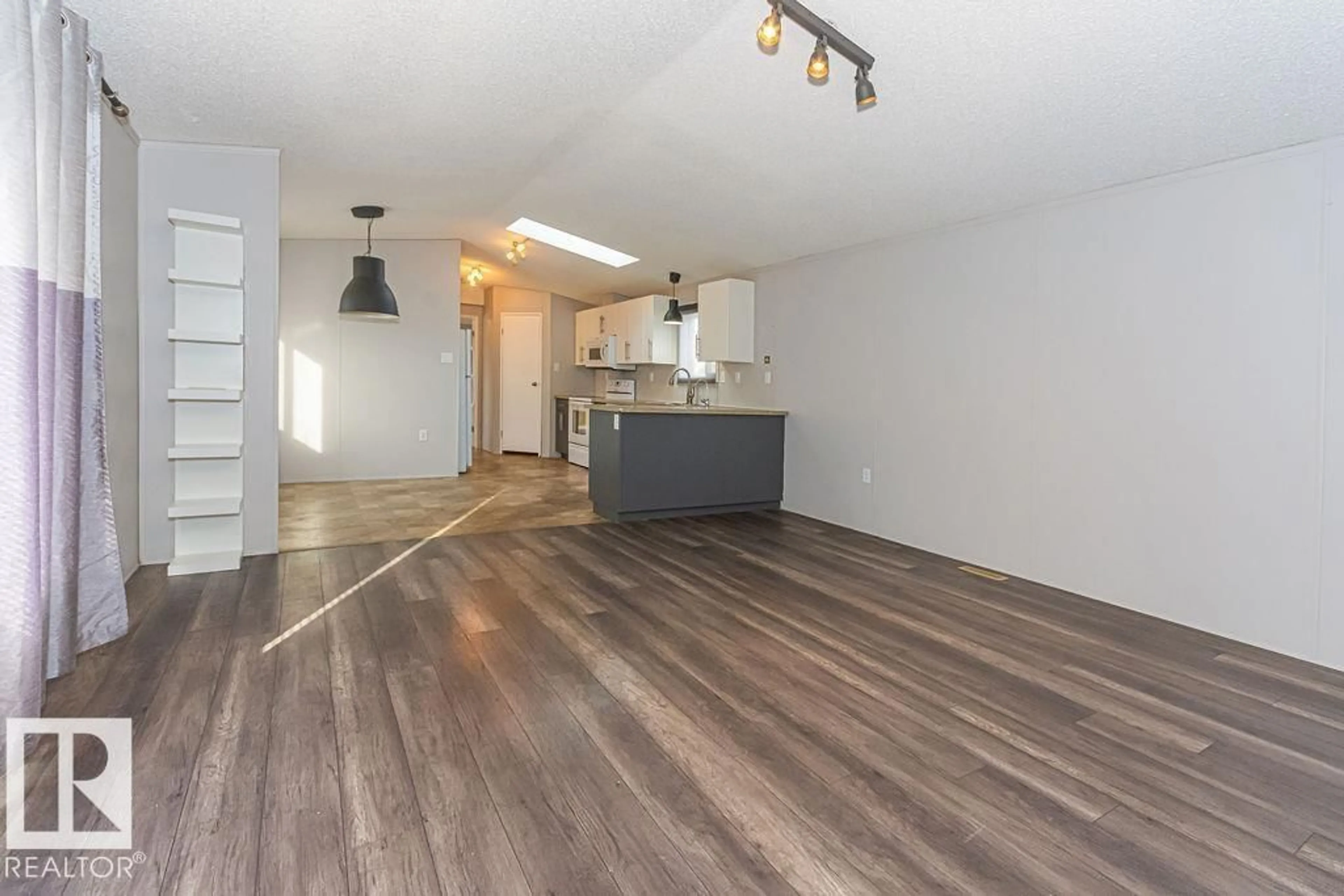 Open concept kitchen, wood/laminate floor for 220 OAK WOOD DR, Edmonton Alberta T6P0A3