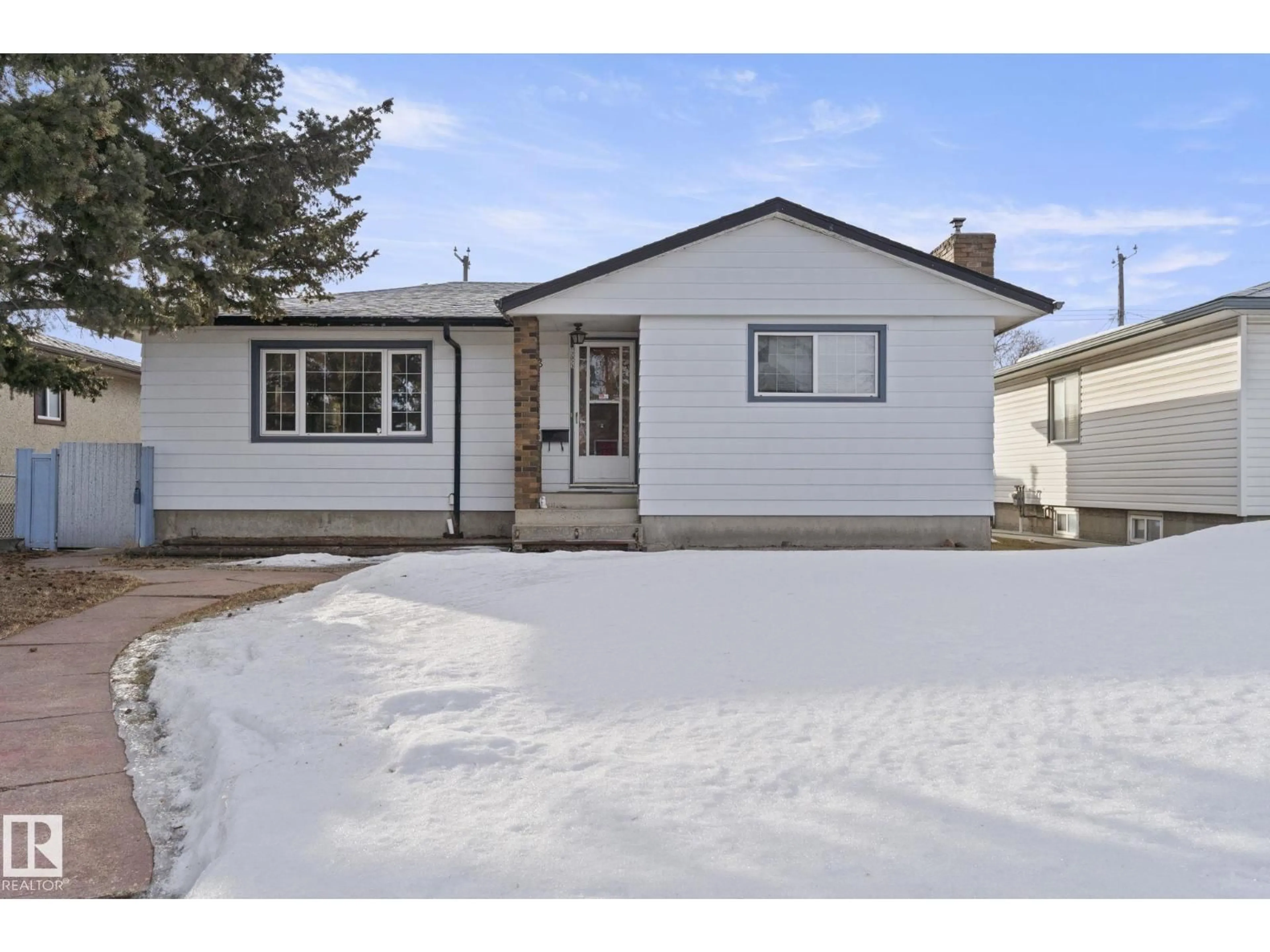 Home with vinyl exterior material, street for NW - 12023 137 AV, Edmonton Alberta T5E1Z7