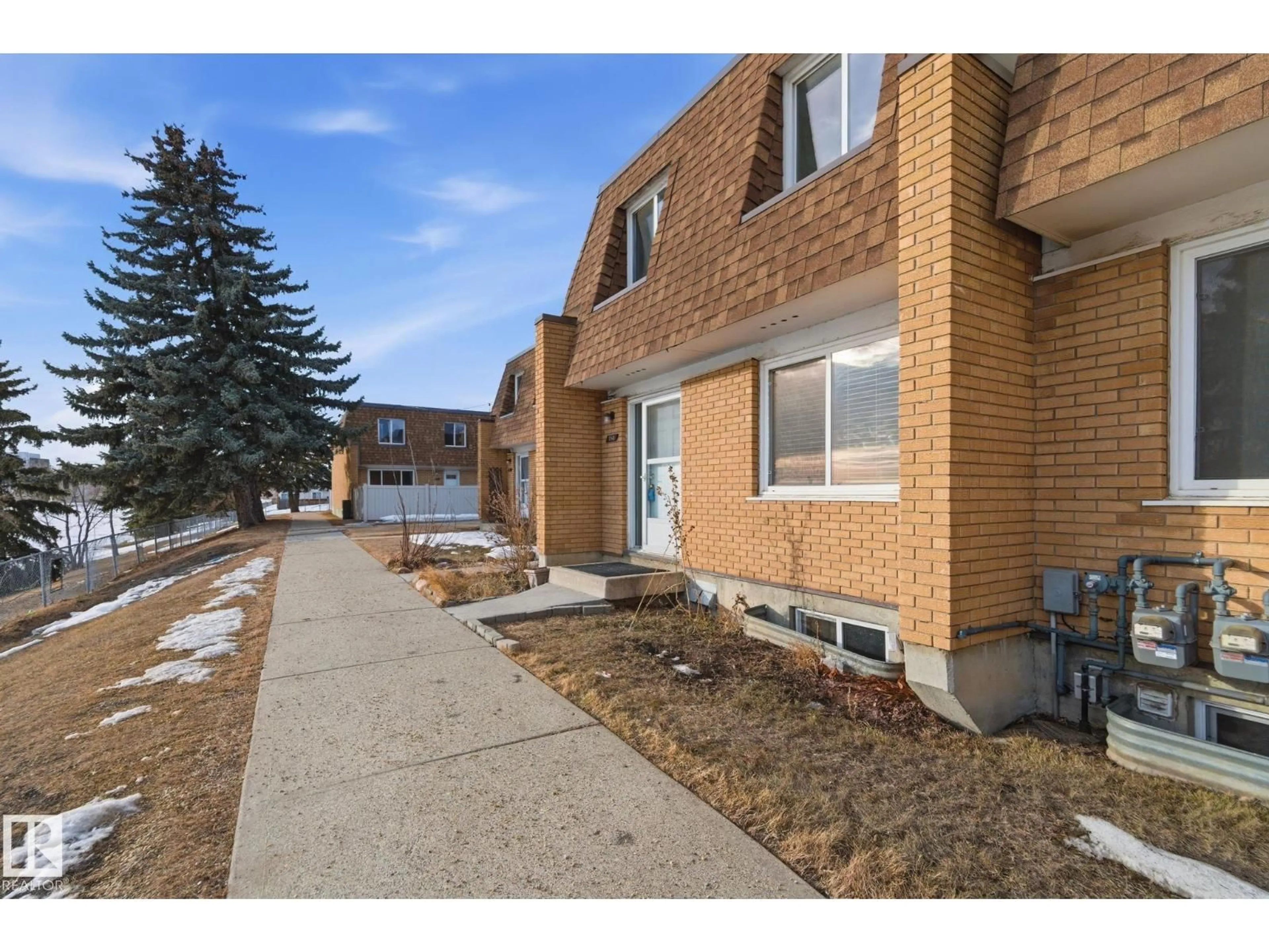 Home with brick exterior material, street for 180 LONDONDERRY SQ, Edmonton Alberta T5C3C4