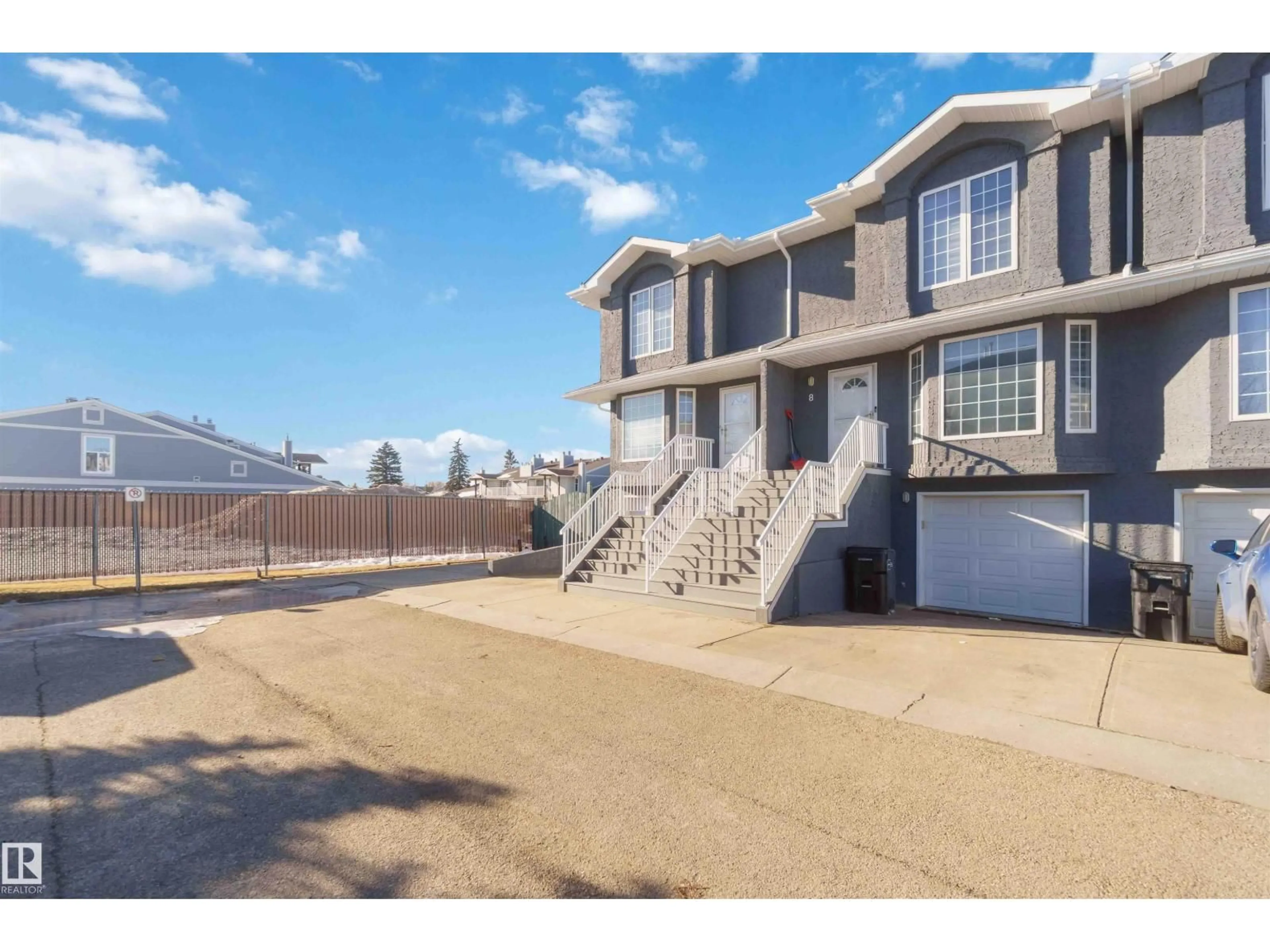 A pic from outside/outdoor area/front of a property/back of a property/a pic from drone, water/lake/river/ocean view for #8 - 15128 22 ST NW, Edmonton Alberta T5Y2W5