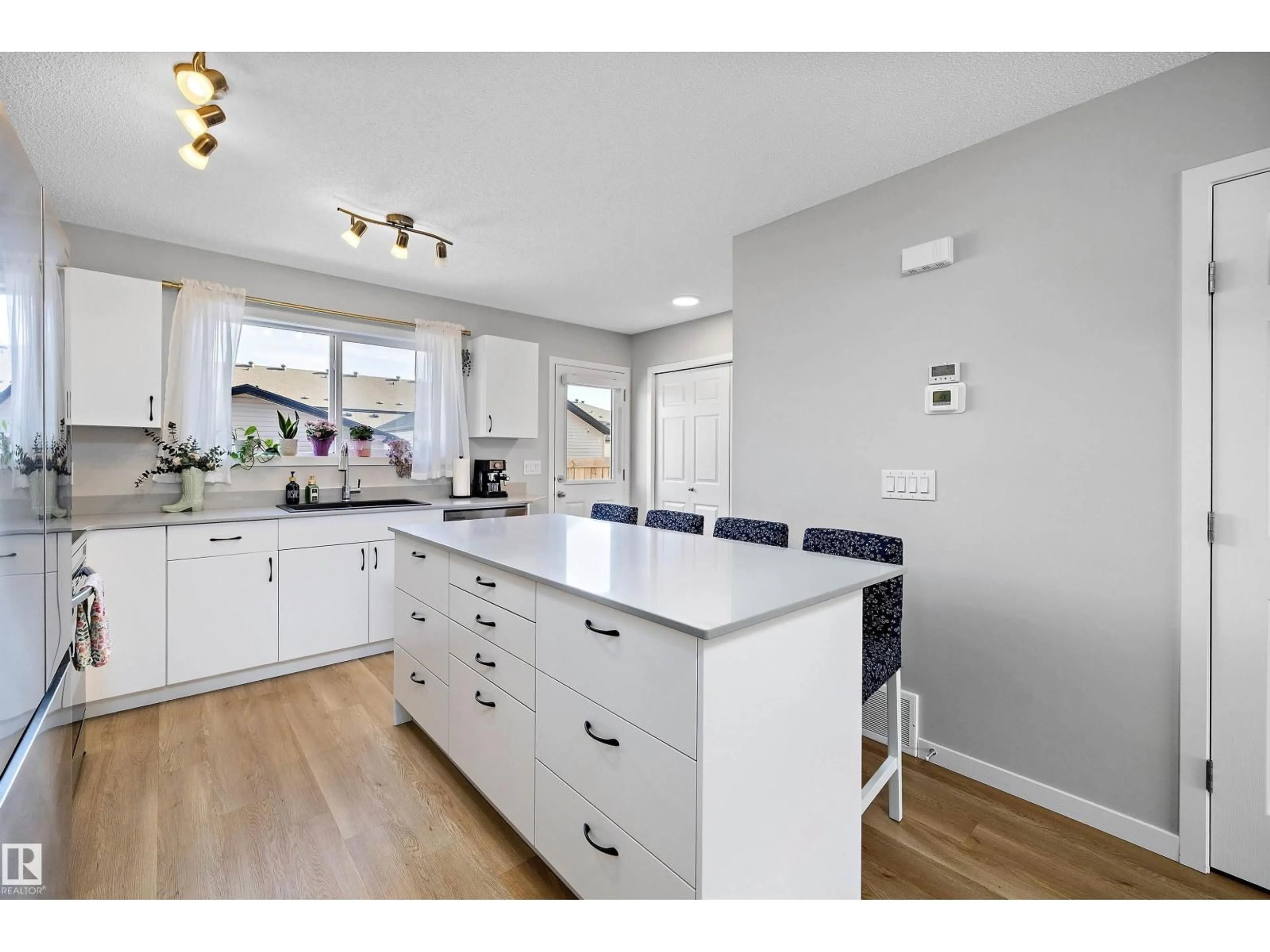 Open concept kitchen, wood/laminate floor for 311 SUNLAND WY, Sherwood Park Alberta T8H2Y8