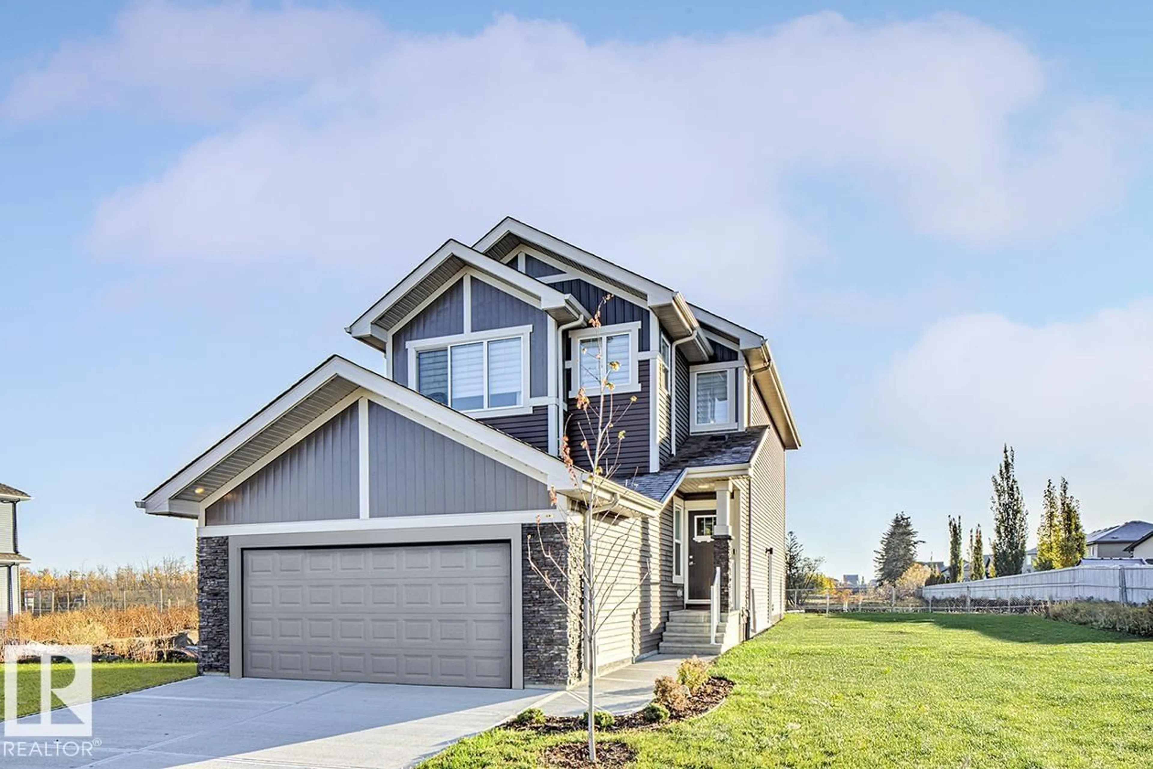 Home with vinyl exterior material, street for 6292 180 AV, Edmonton Alberta T5T1L6